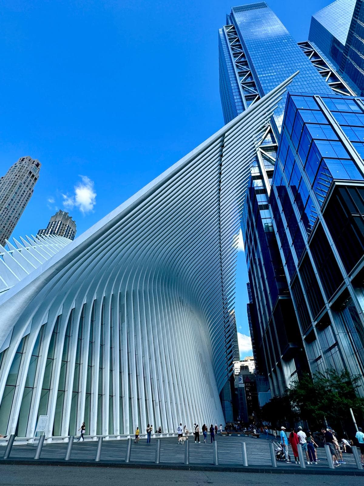 View of a tall unique building during the daytime.