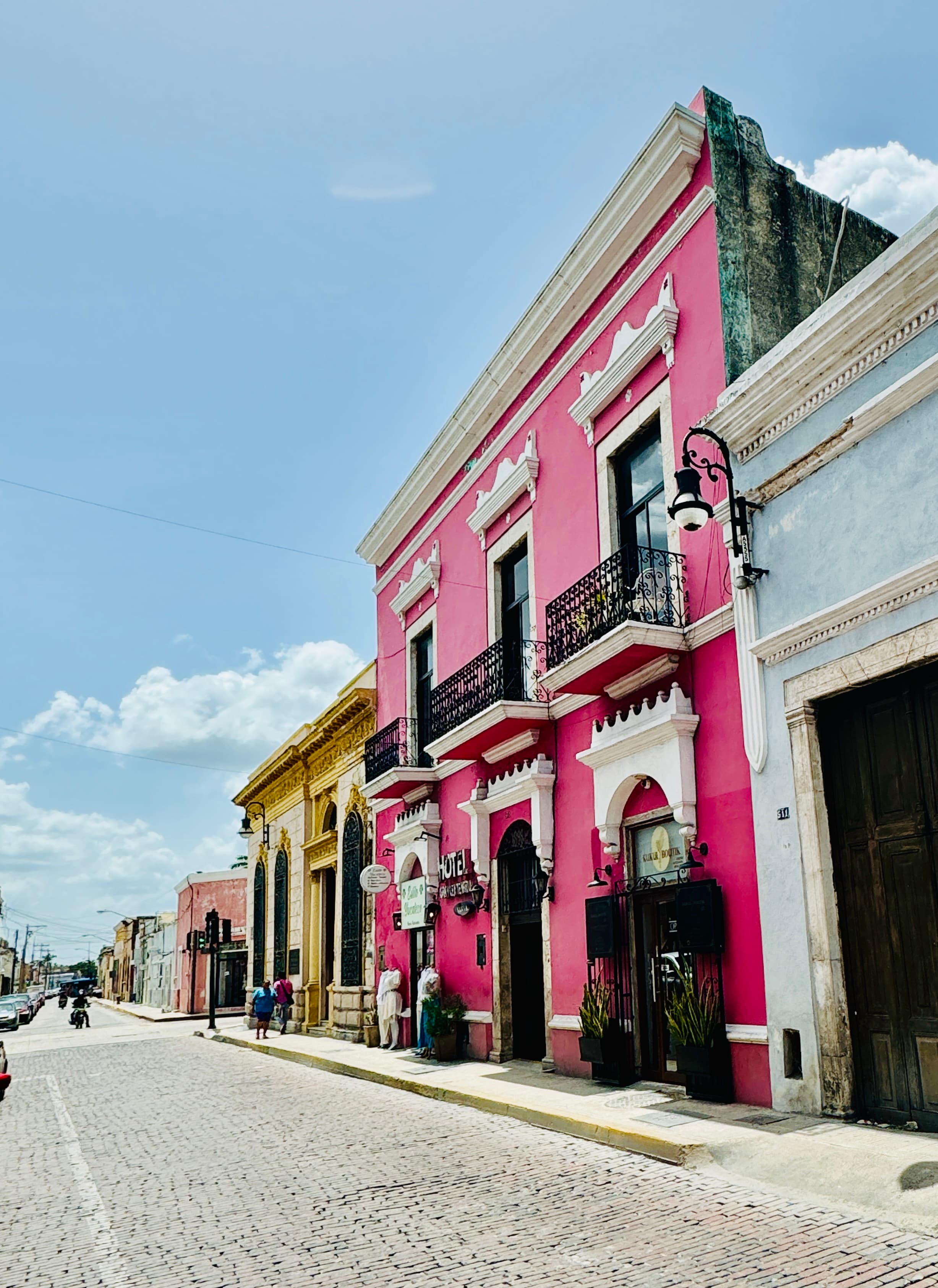 View of a pink building from outside during the daytime.