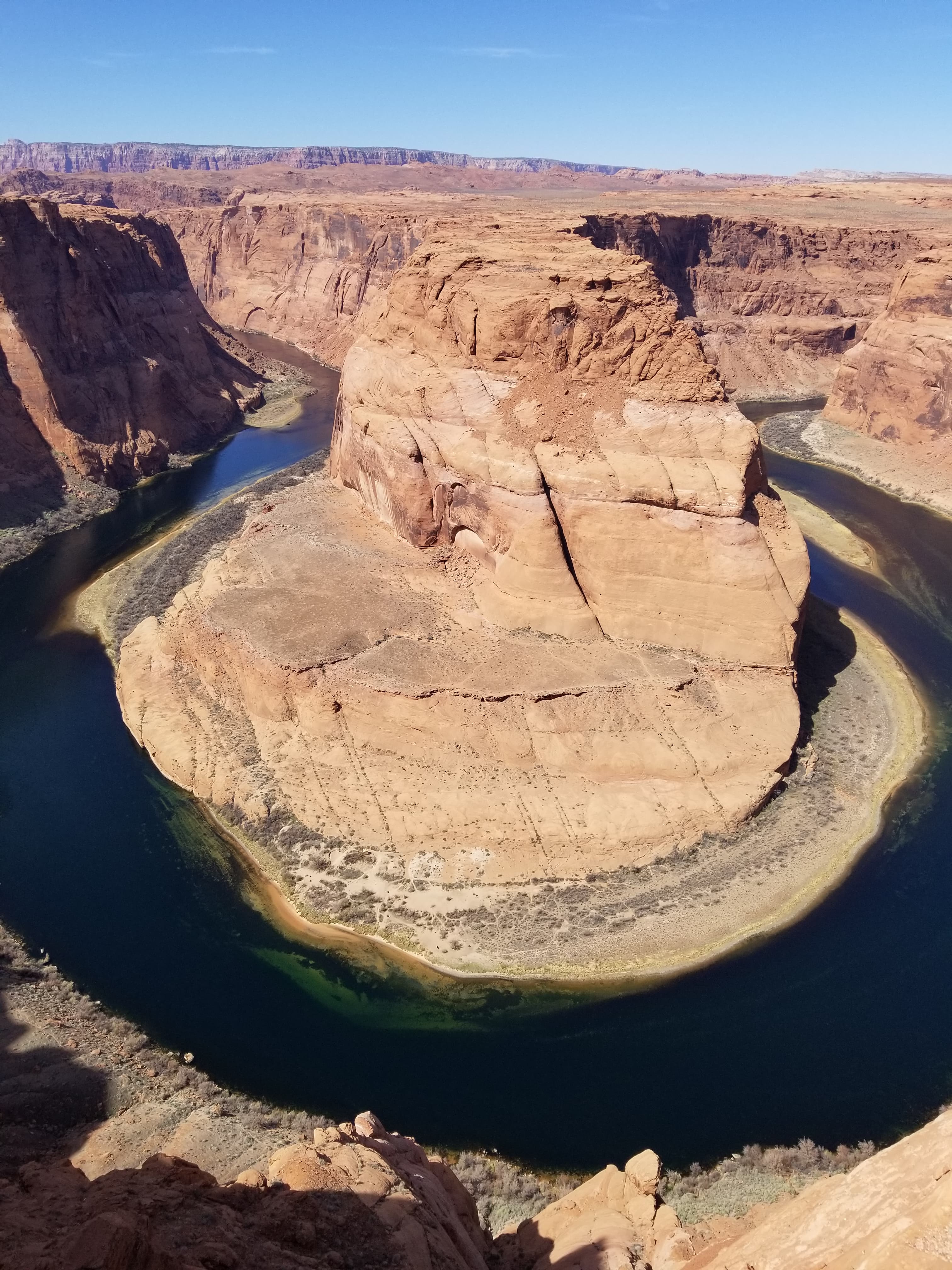 A round rock formation in a canyon during the daytime