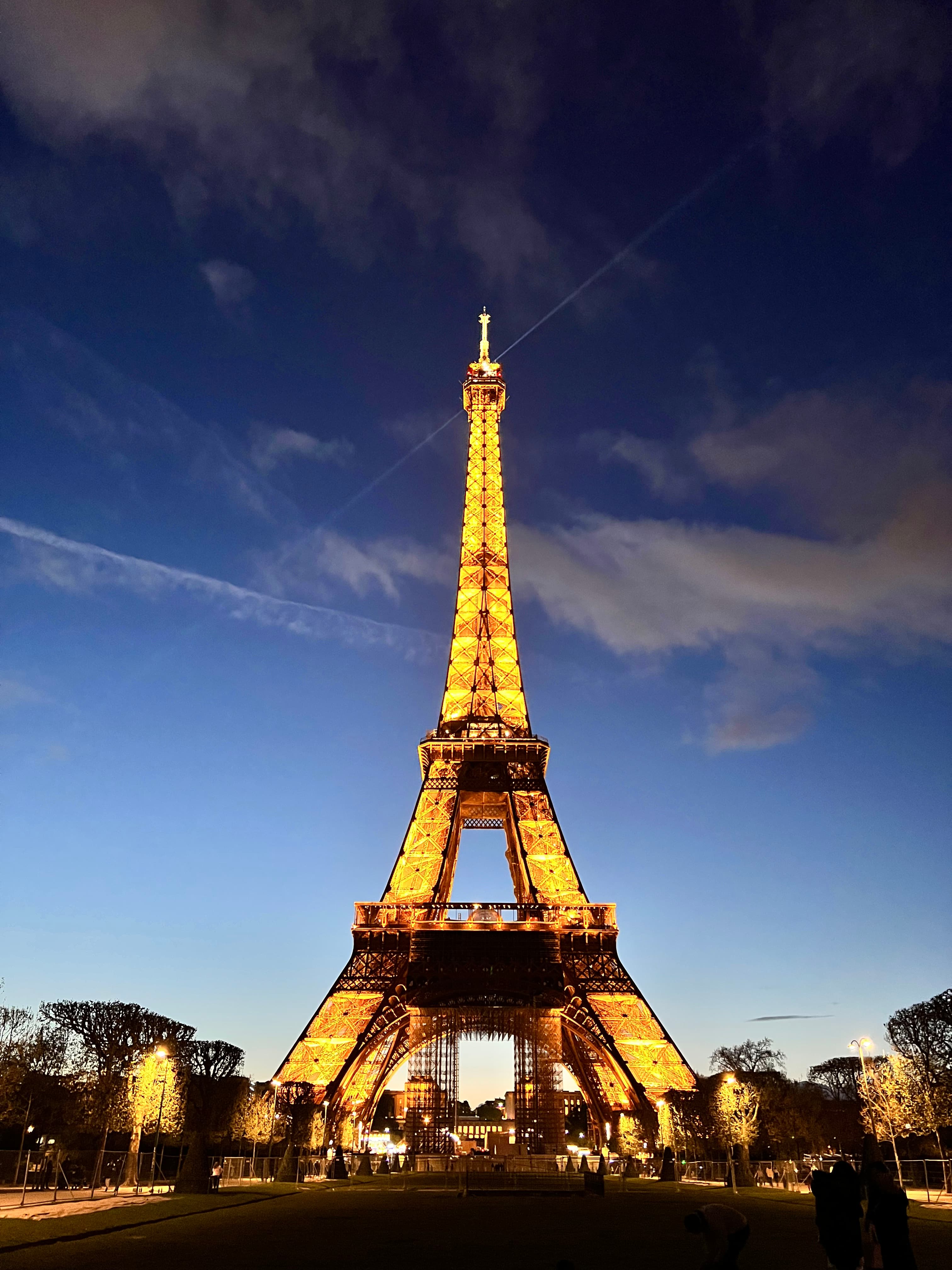 The Eiffel Tower at night light up.