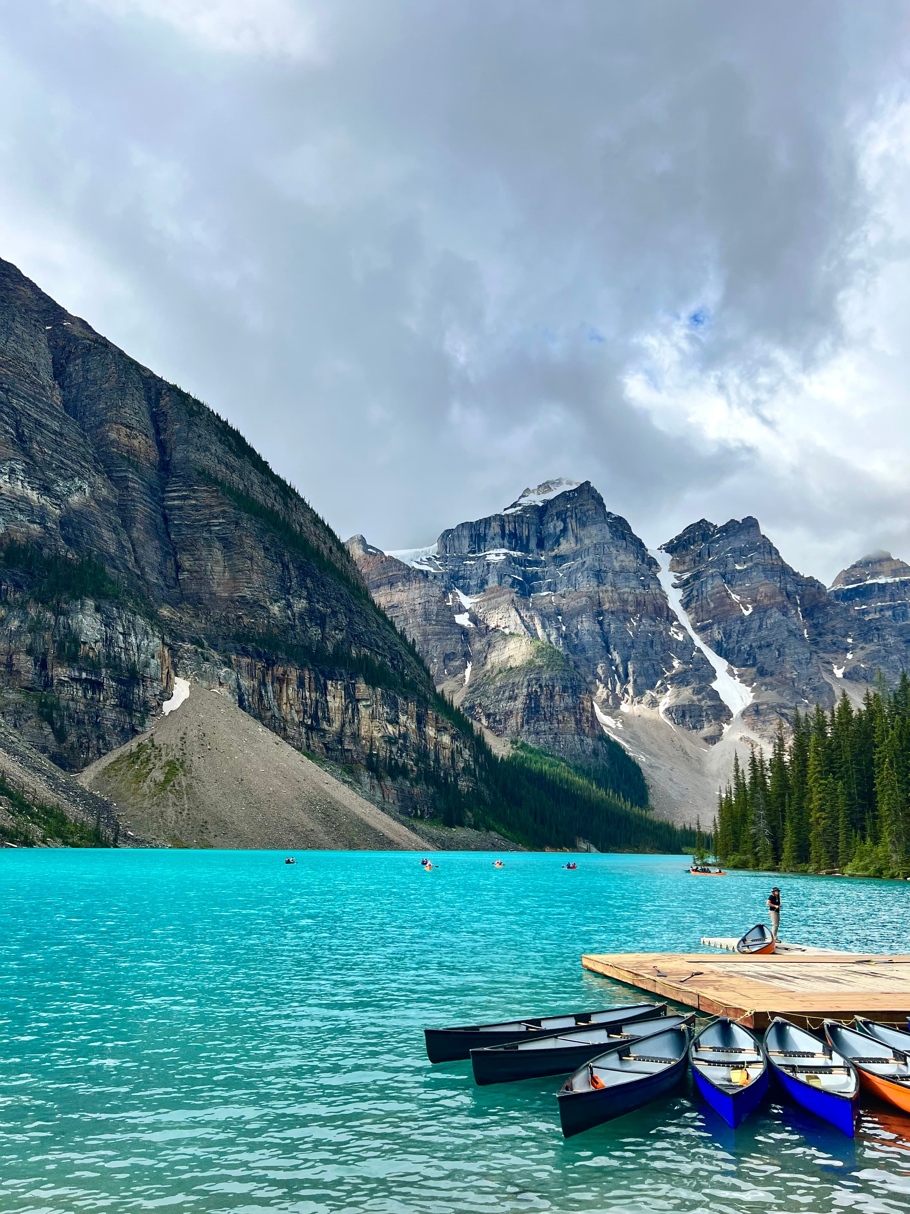 A view of a lake with mountains in the distance. 