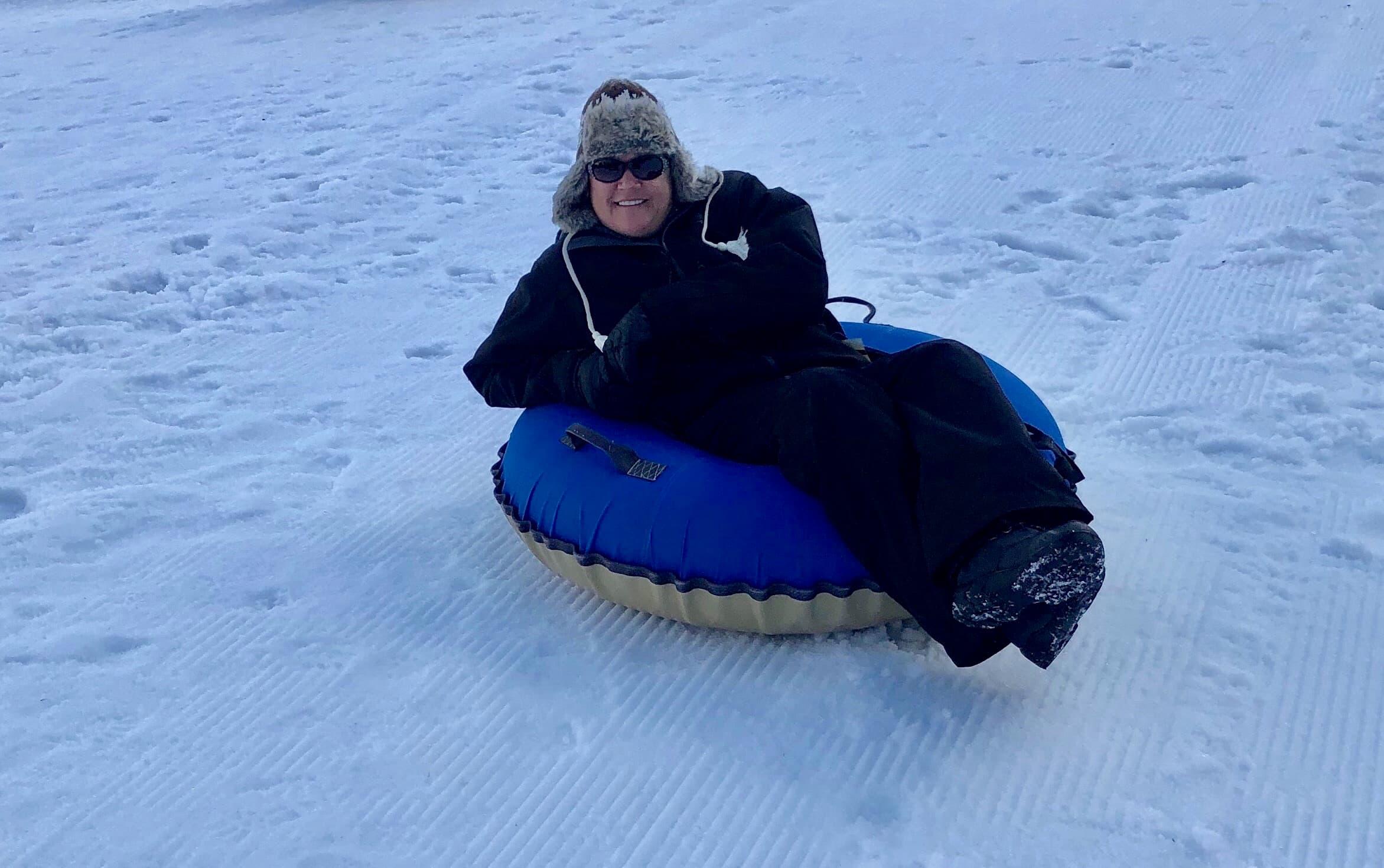 Sledding in the snow.