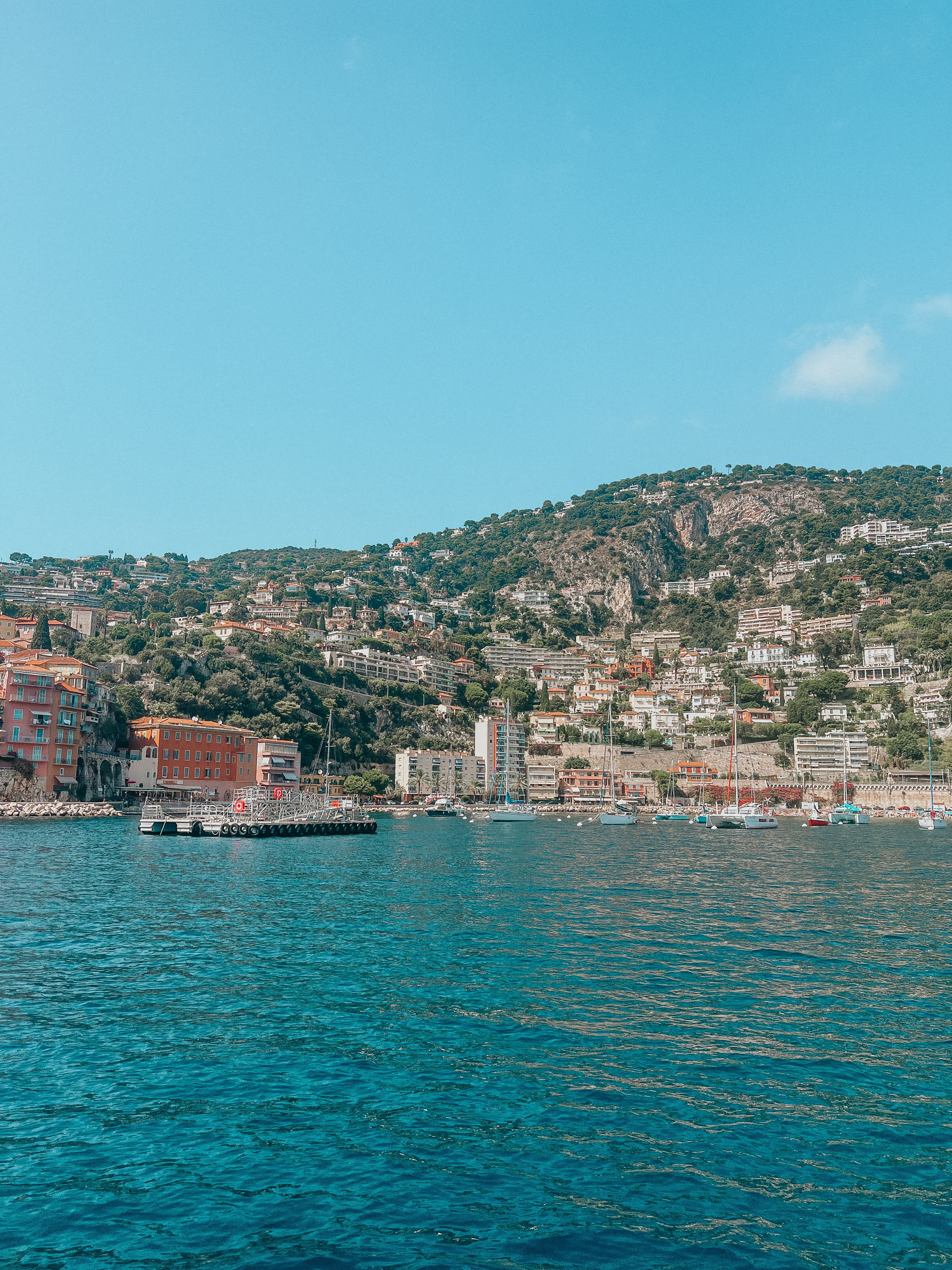 View of a coastal city seen from the sea on a sunny day