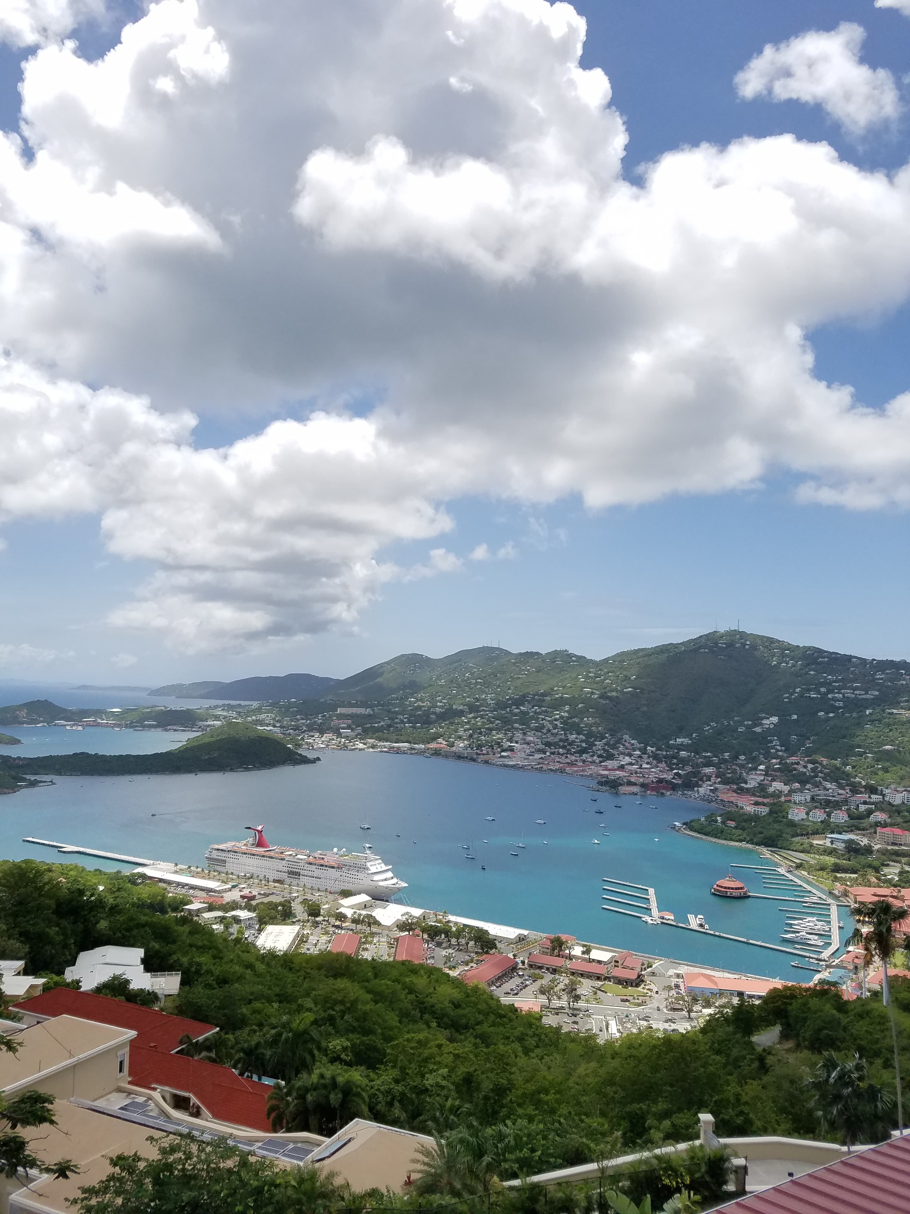 Aerial view of a bay and coastal town on a sunny day