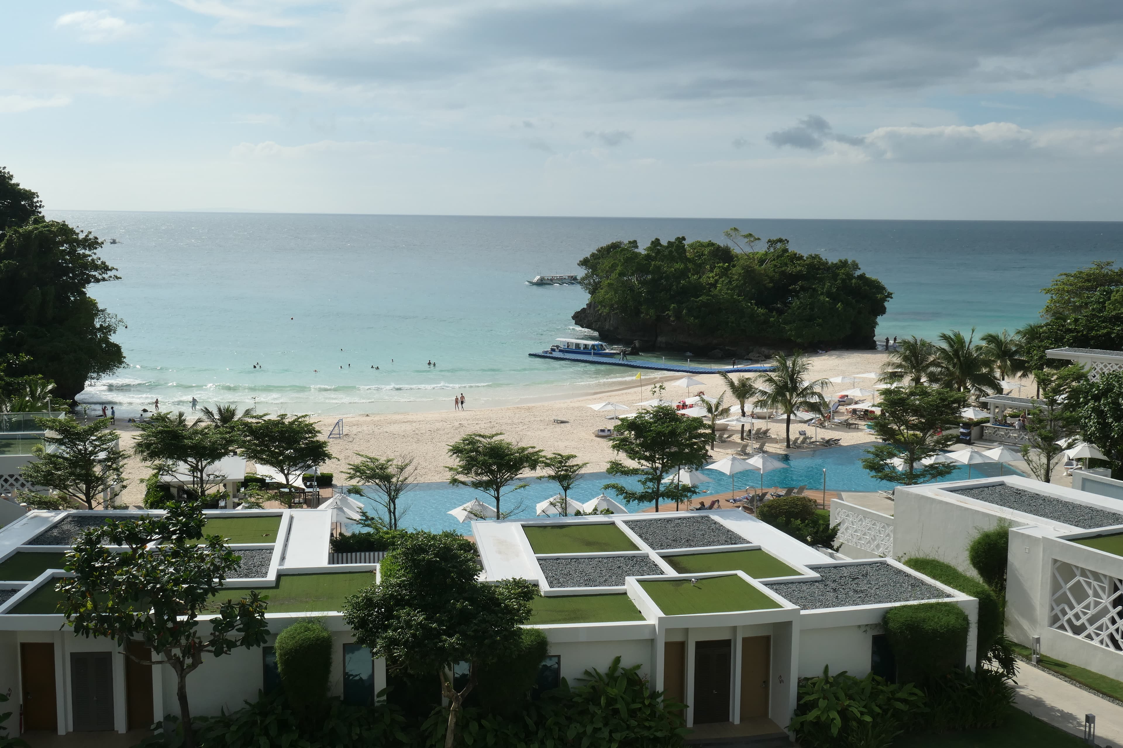 Aerial view of hotel buildings next to the beach during the daytime