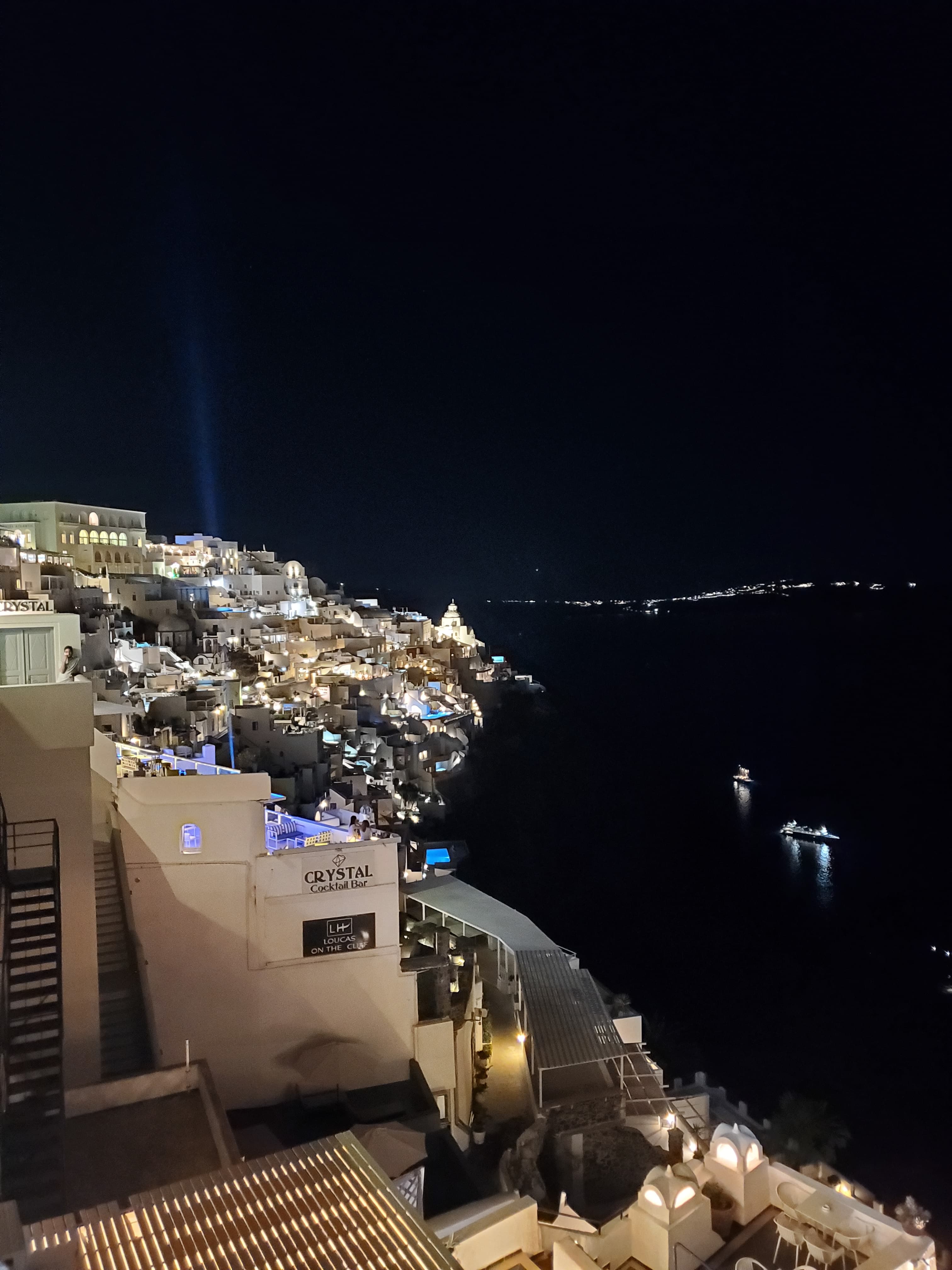 View of a coastline lit up at night