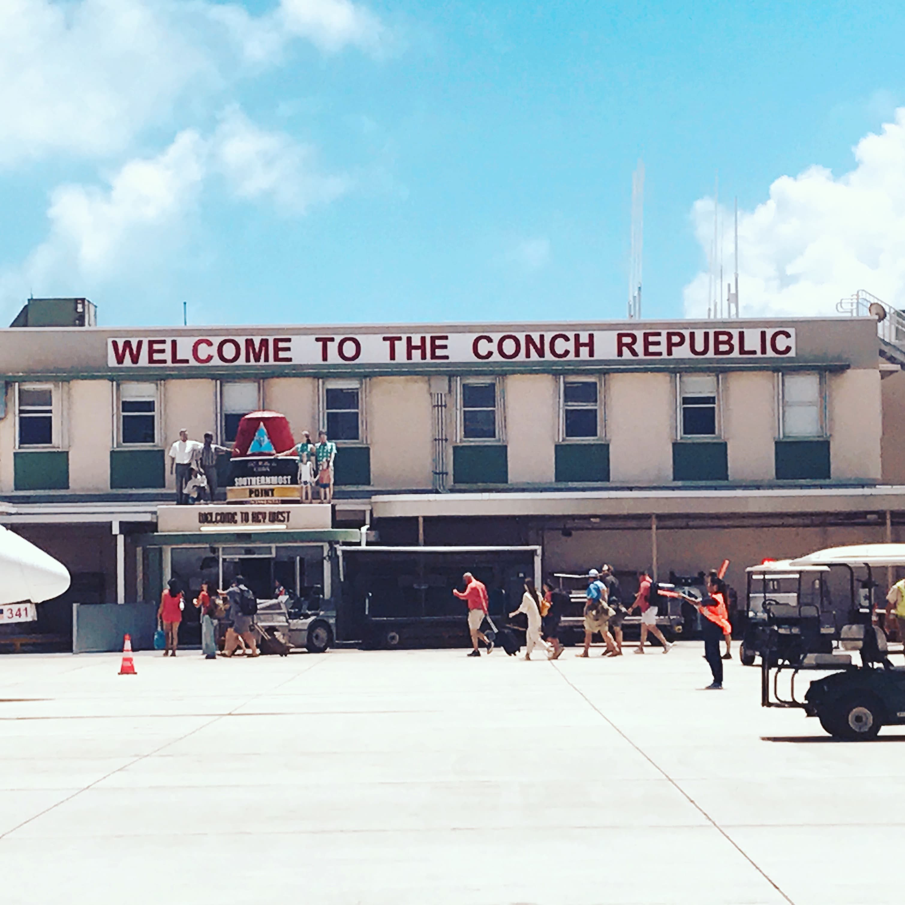 A boat featuring a prominent sign that reads "Welcome to the Coch Republic," welcoming guests to the area.