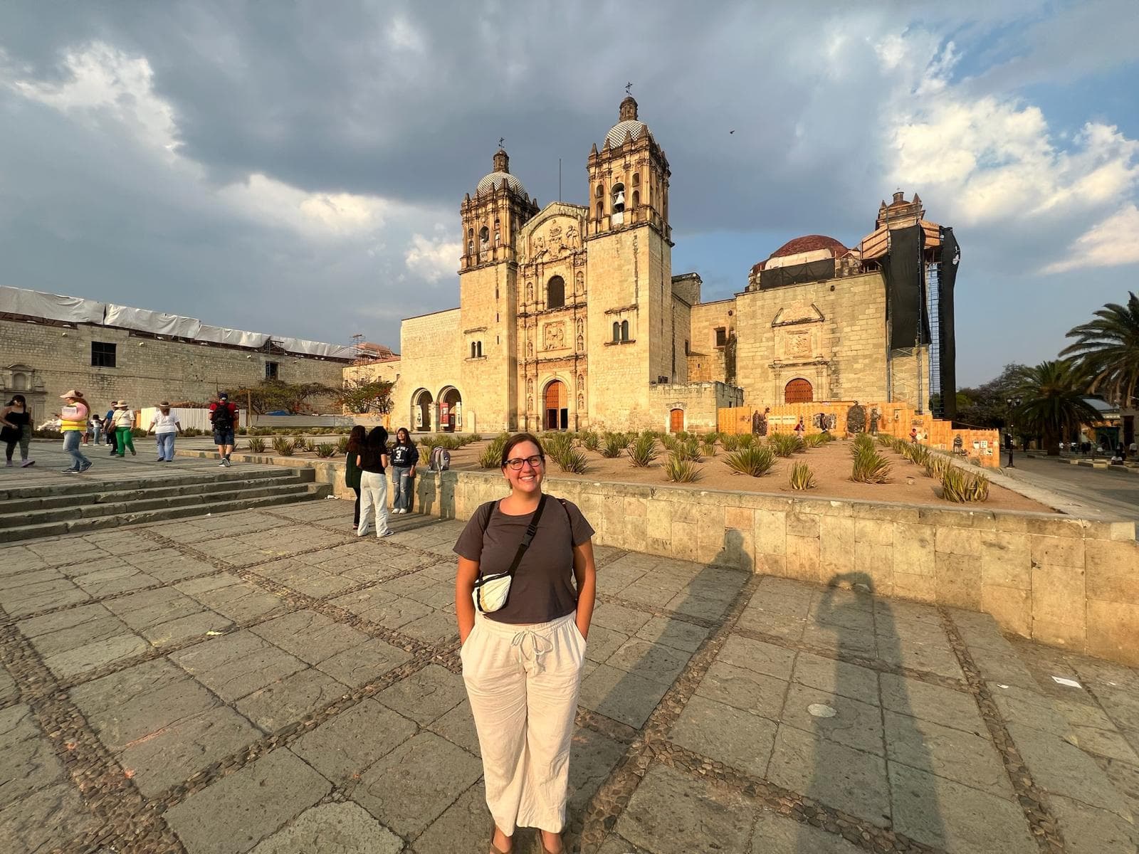 Advisor standing in a plaza in front of a beautiful old white church