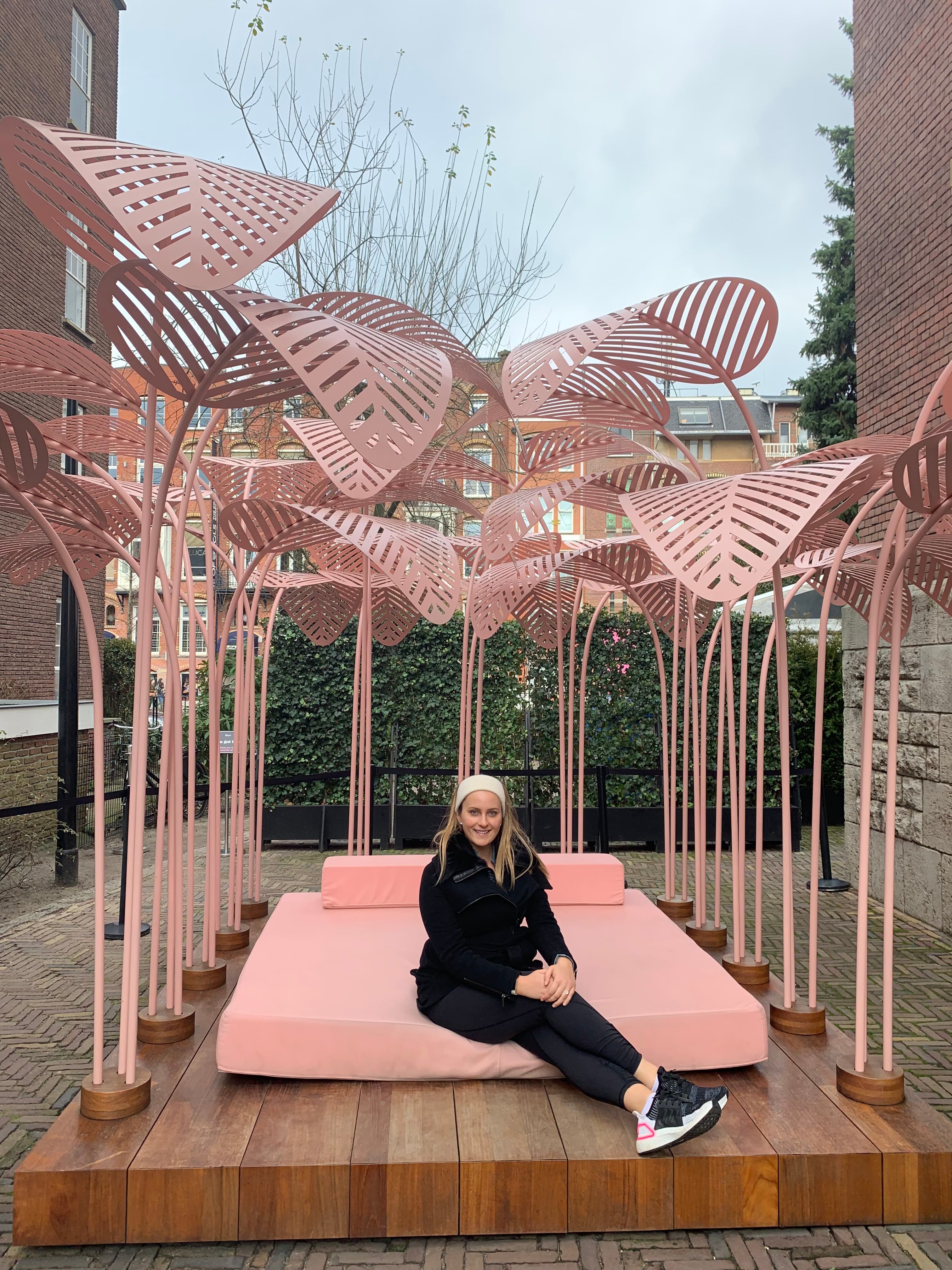 Sitting on pink chairs.