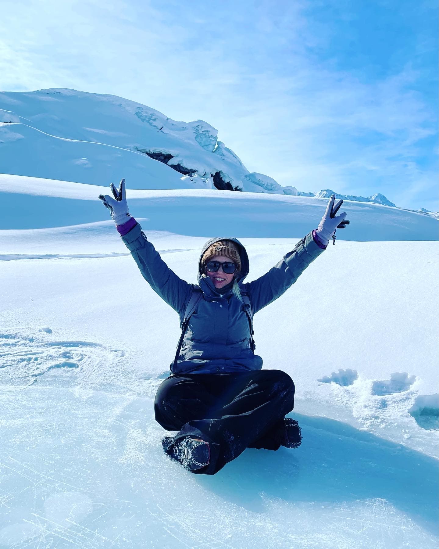 Sitting in the snow.