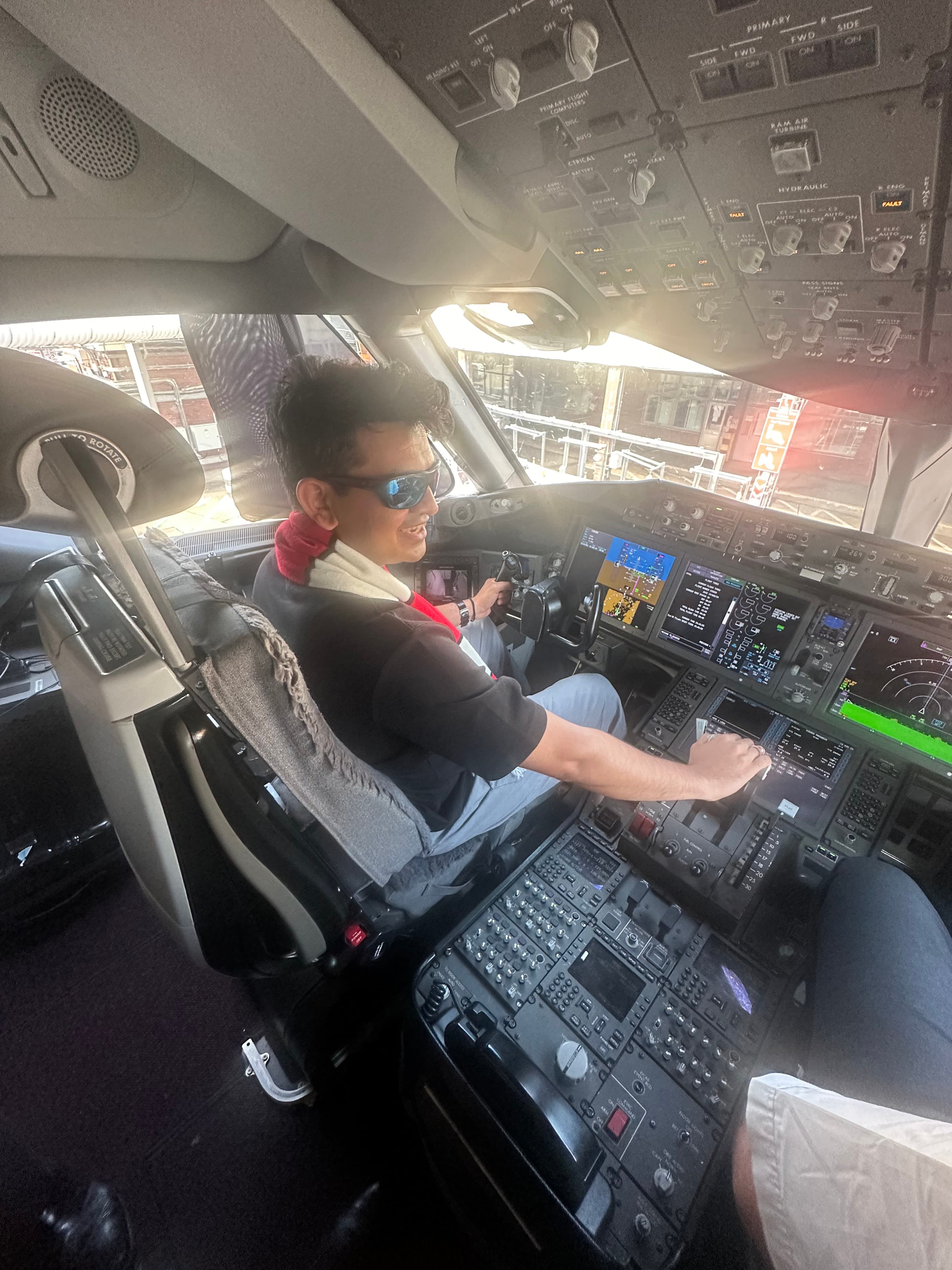 Advisor sitting in the cockpit of an airplane