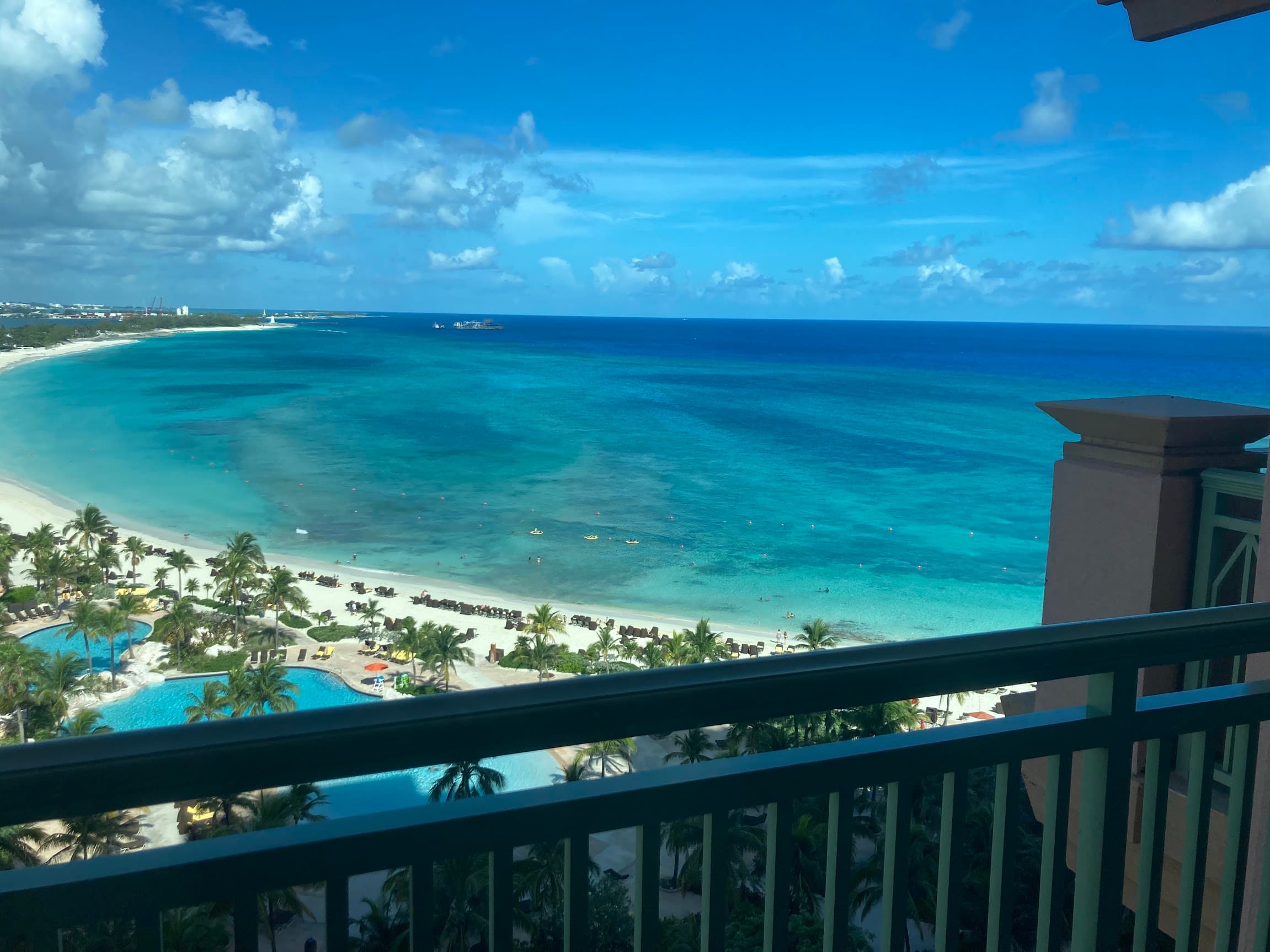 Resort balcony view of a beautiful white sand beach and turquoise sea