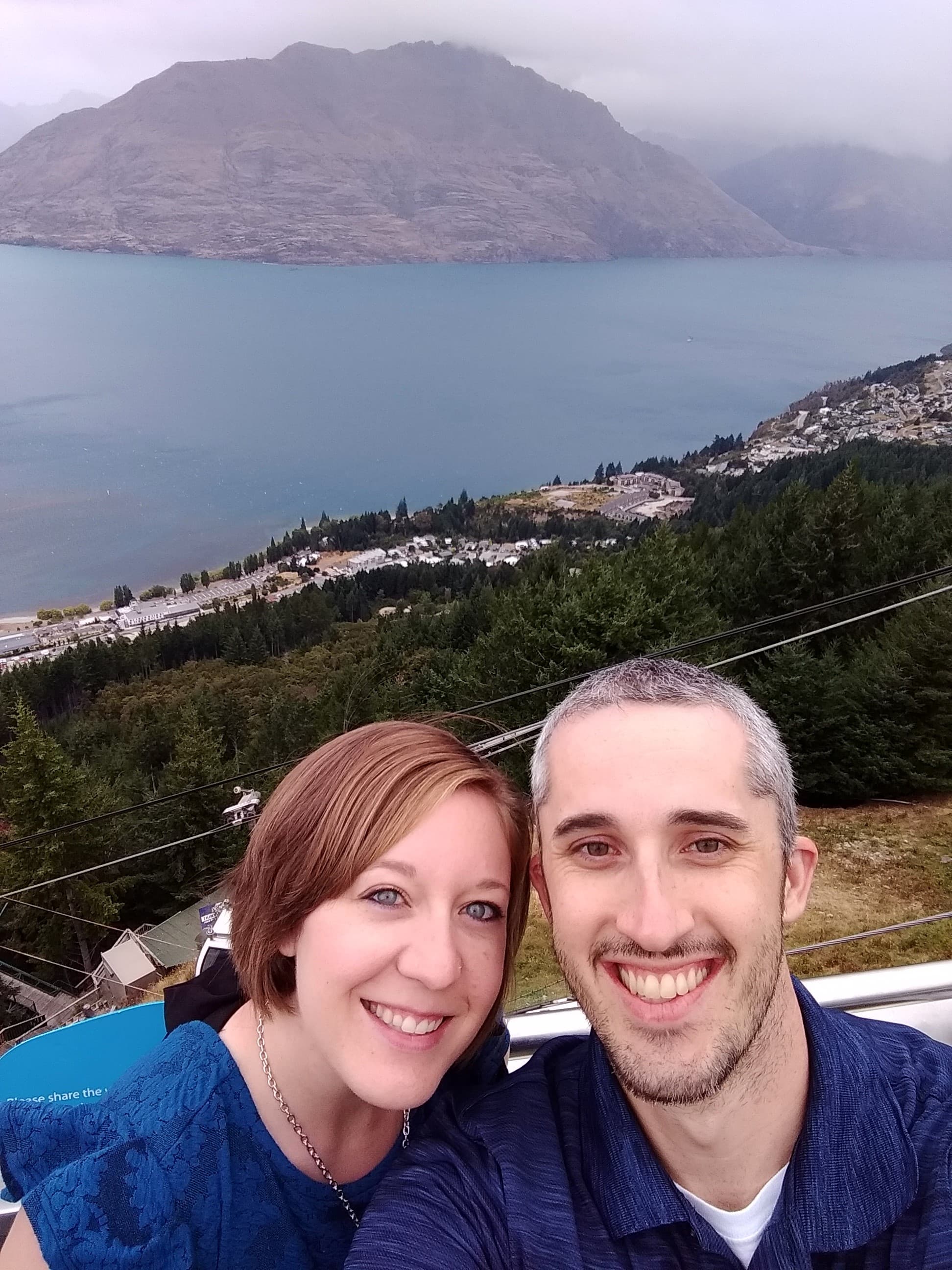 Chelsea posing with partner with the mountains and nature scenery in the background.