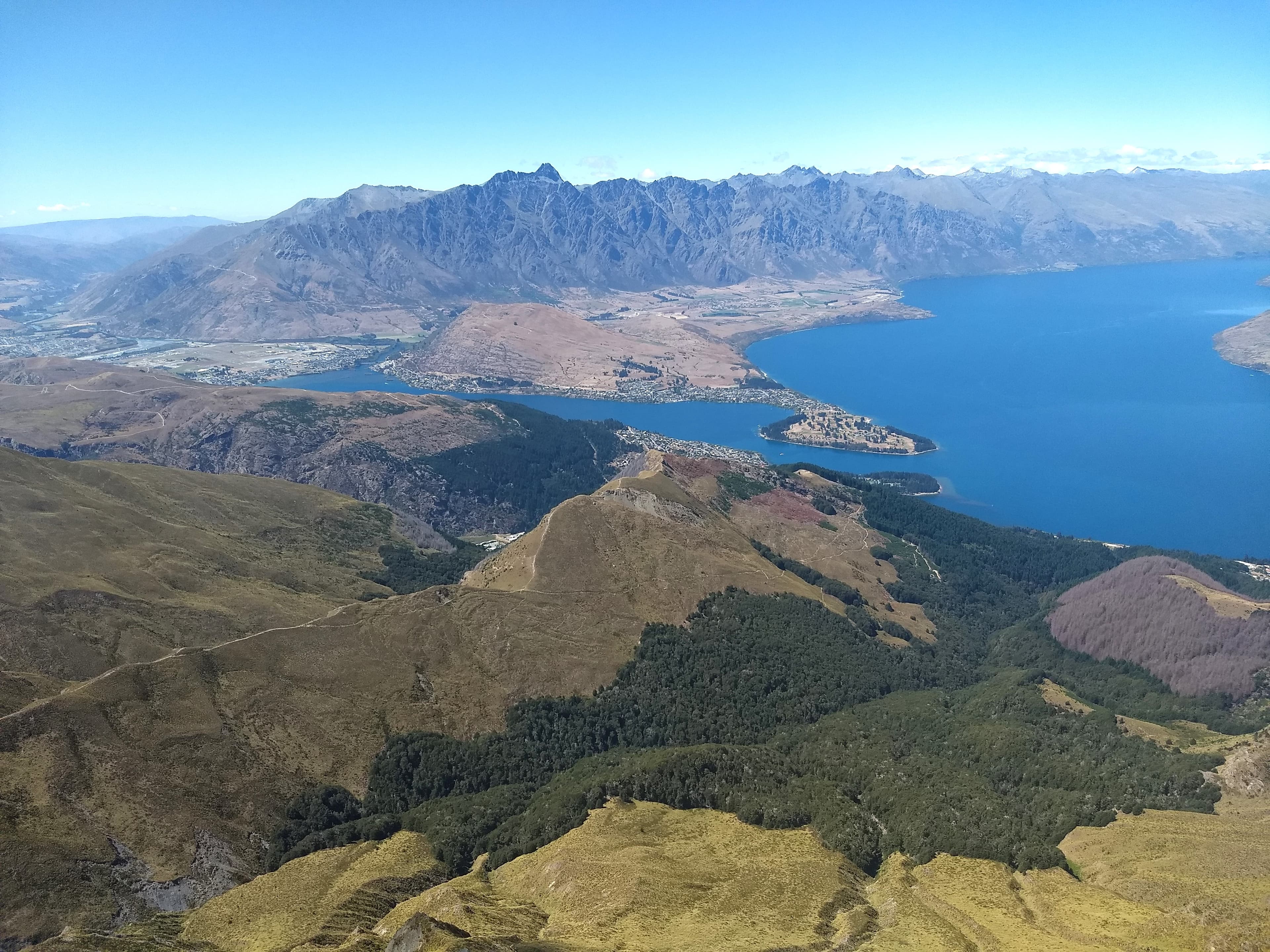 Scenic view of the mountains and ocean during the daytime.