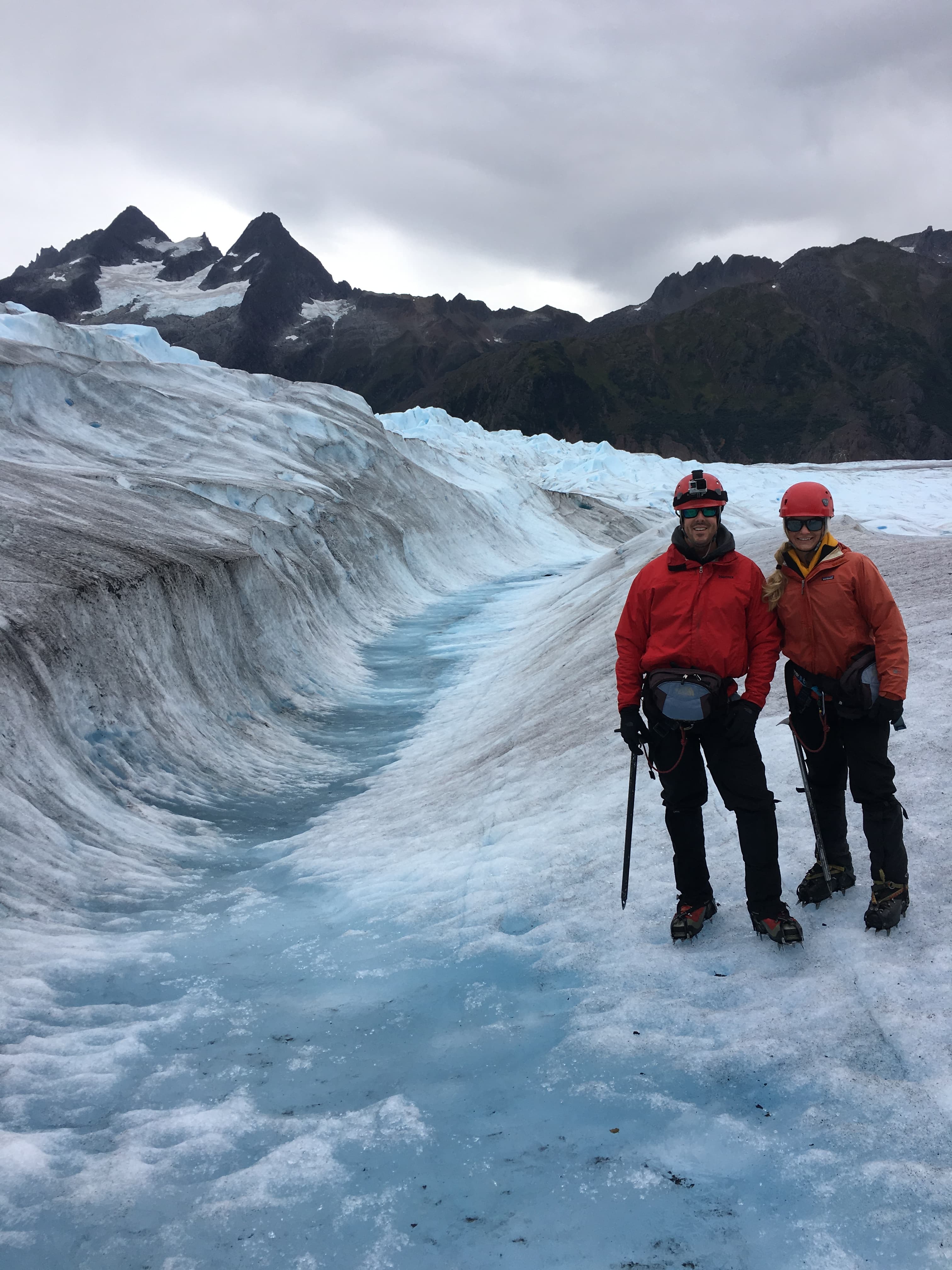 Advisor and partner in winter jackets walking through an icy environment