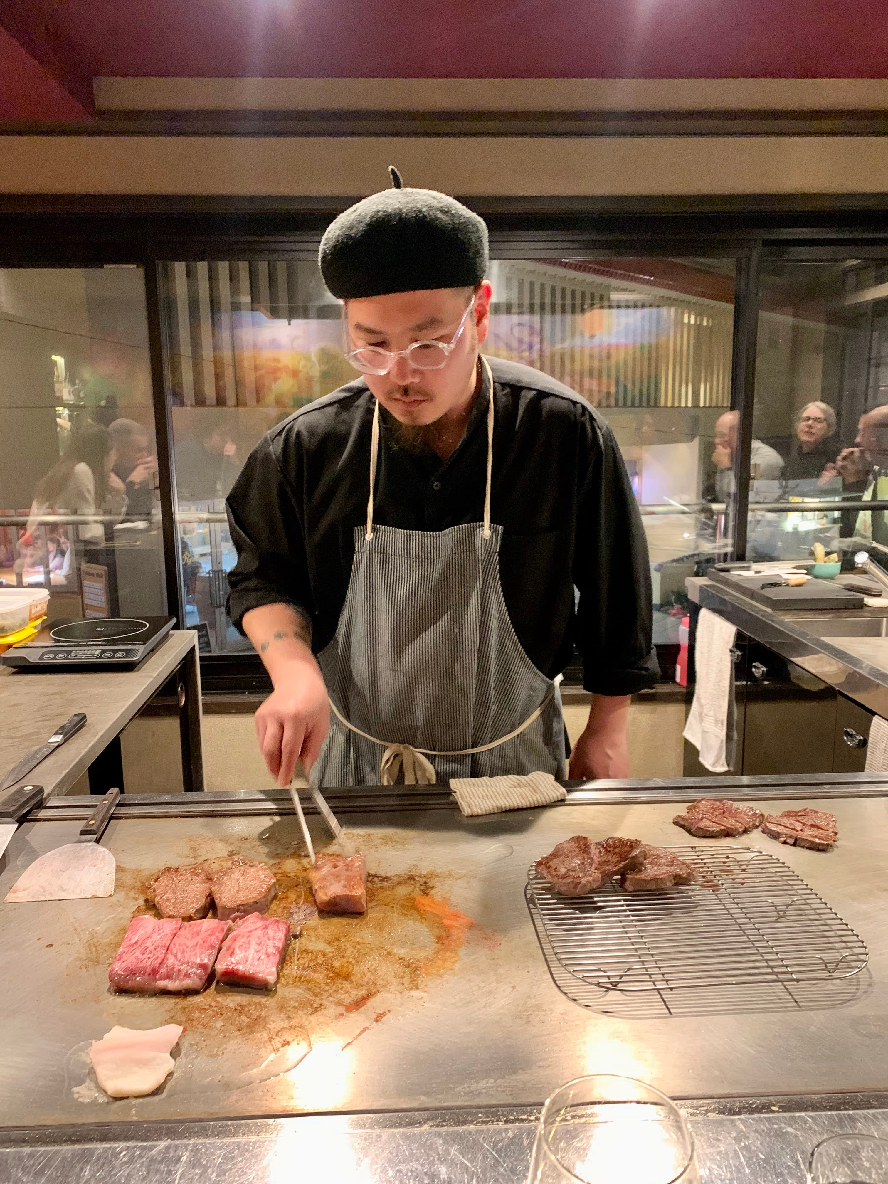 A chef making a fancy meal. 