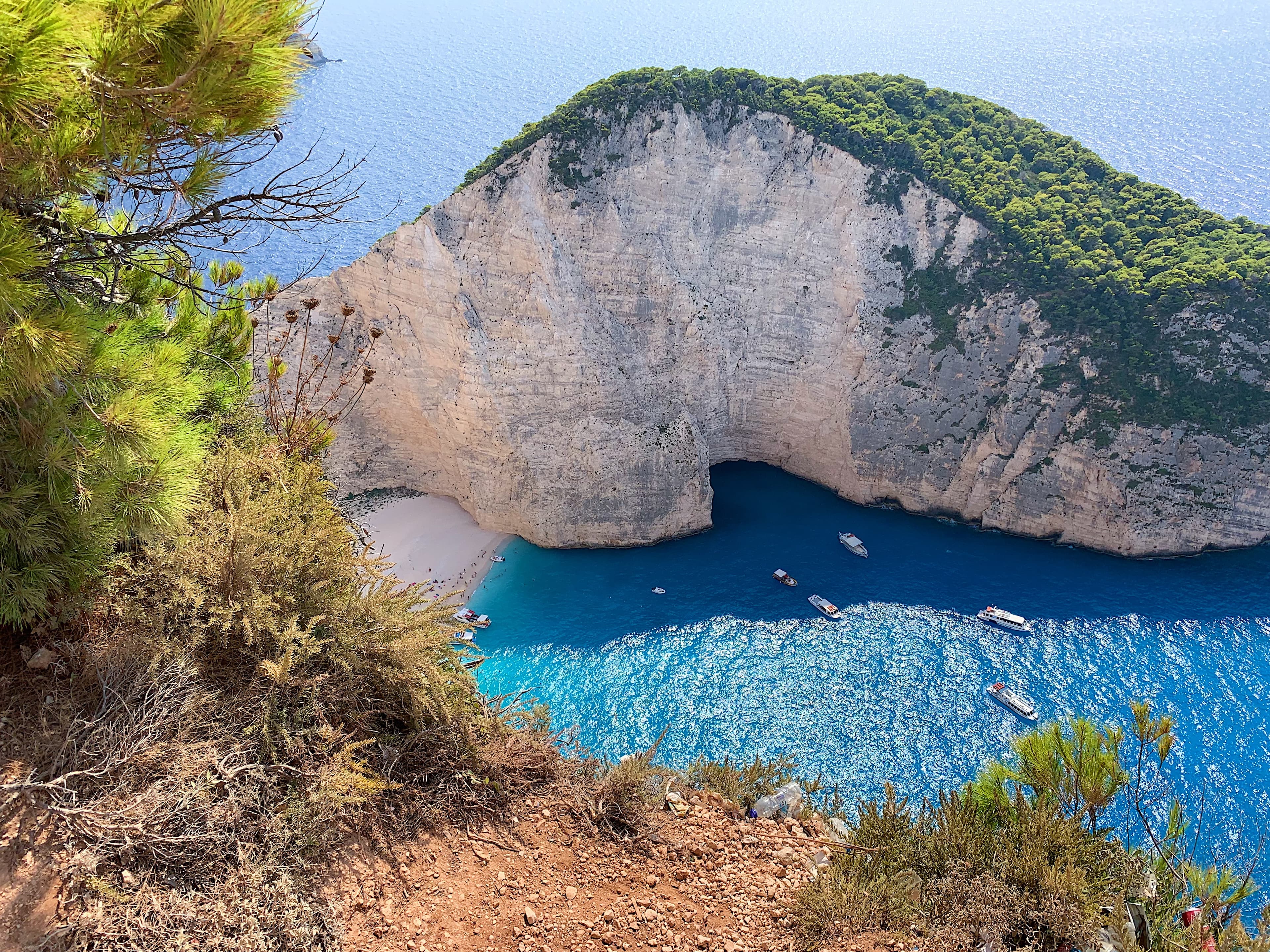 A cliffside next the water during the daytime