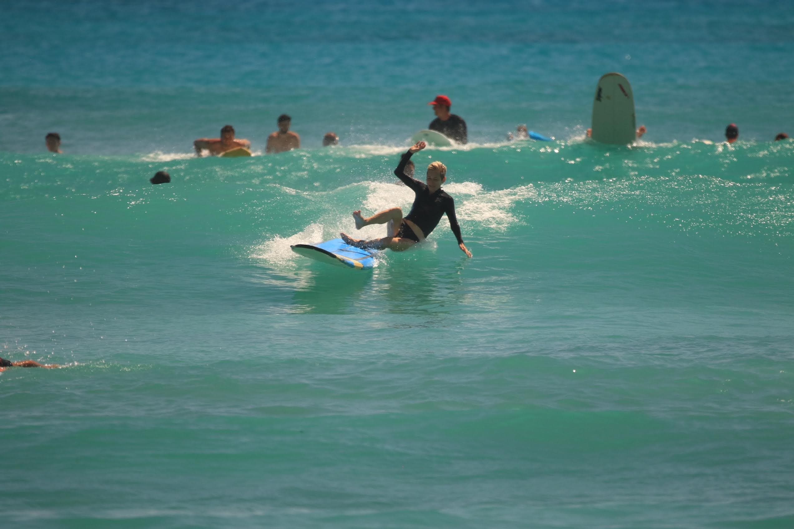Advisor falling off a surfboard