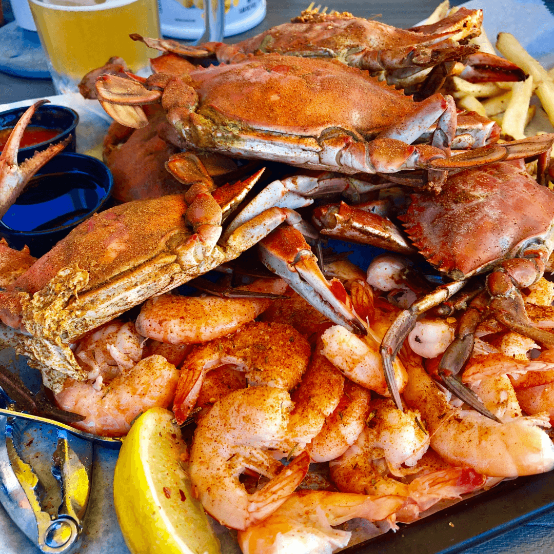 Overhead view of a large plate of seafood including crab and shrimp