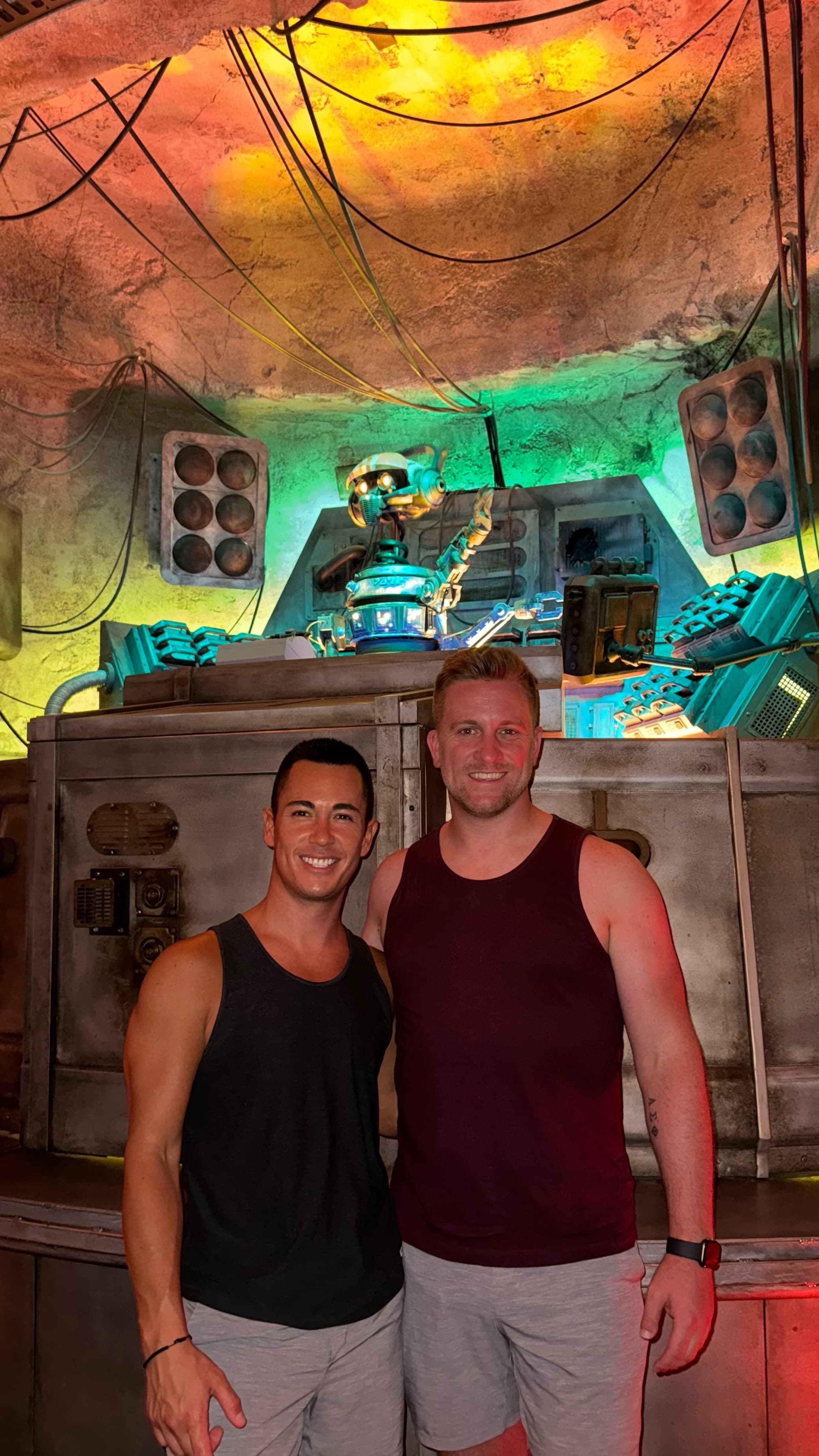 Mike and friend posing indoors.