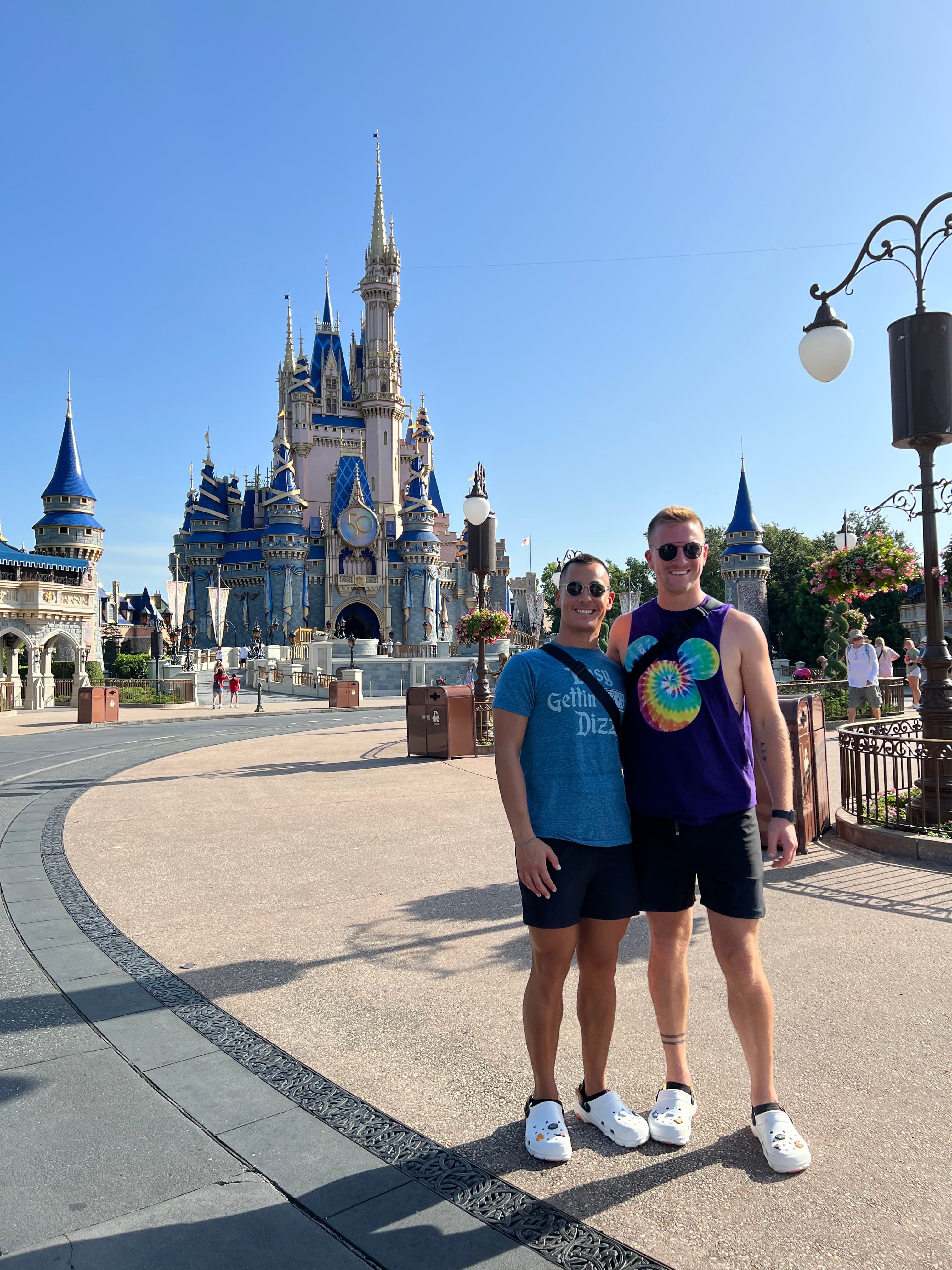 Mike and friend posing at universal during the daytime.