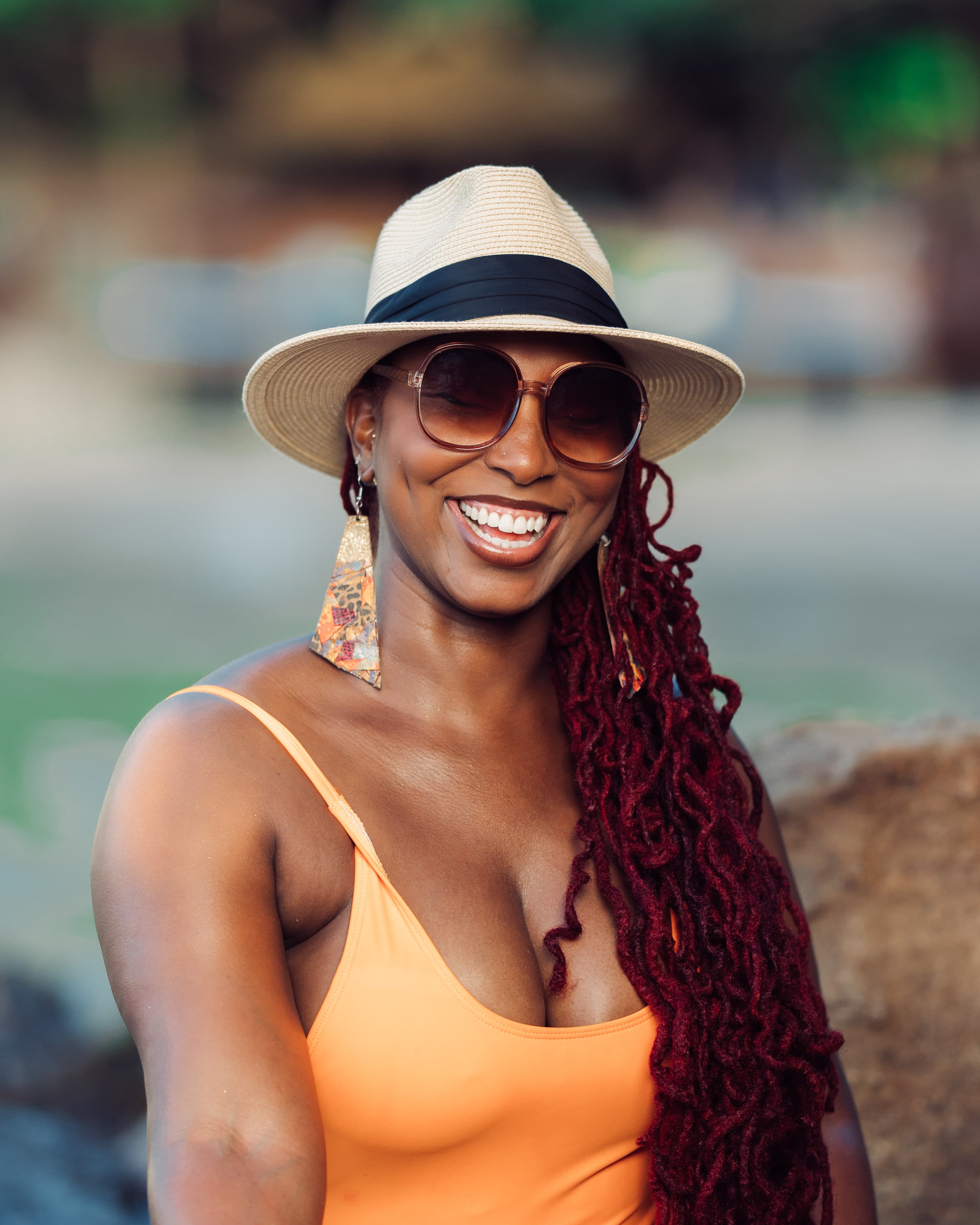 Avia posing for a selfie outdoors during the daytime.