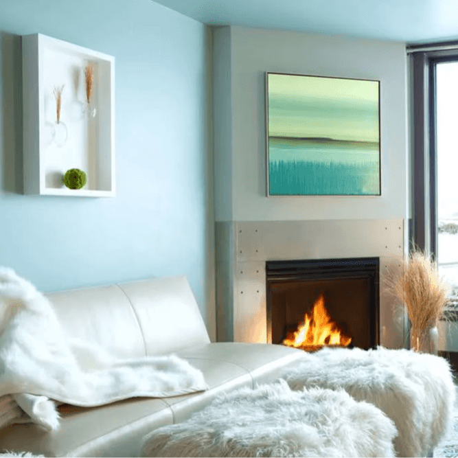 fuzzy white cushions and a white couch in front of a fireplace