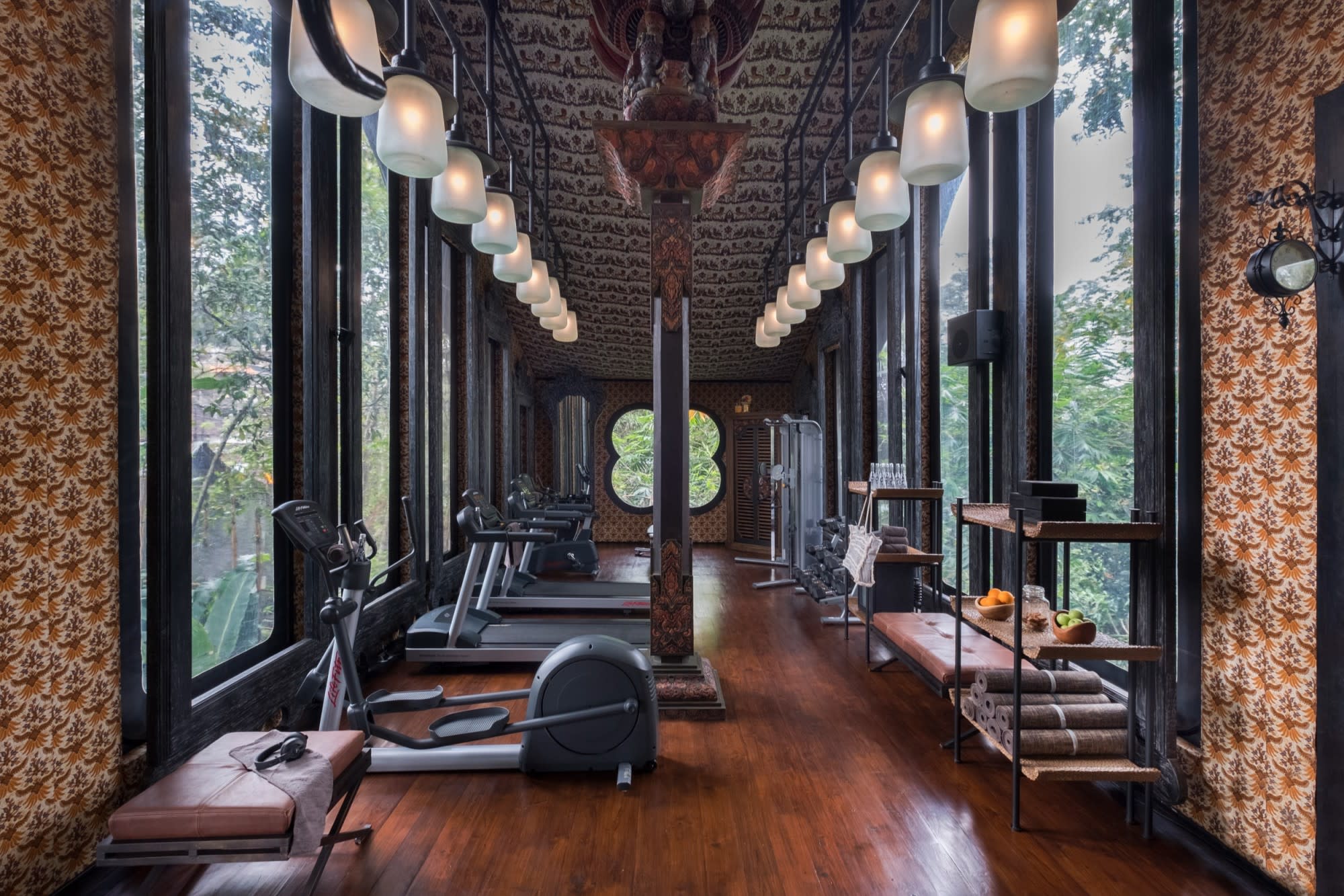 a gym with patterned wallpaper in the jungle