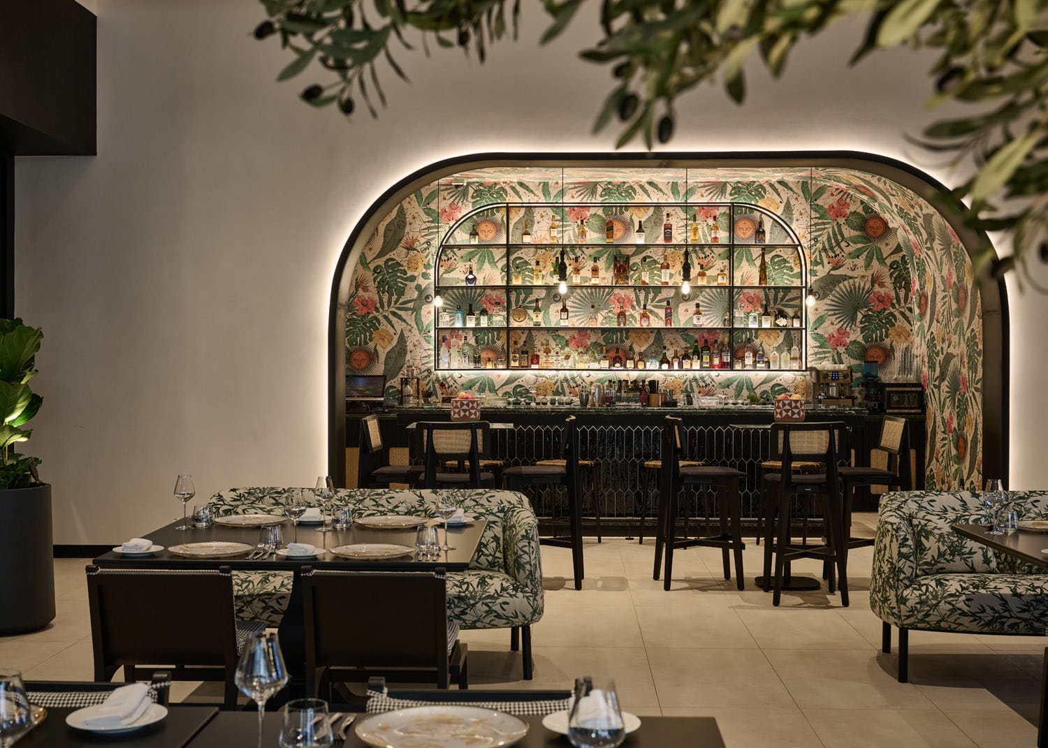 a trendy bar and dining room in a swanky restaurant