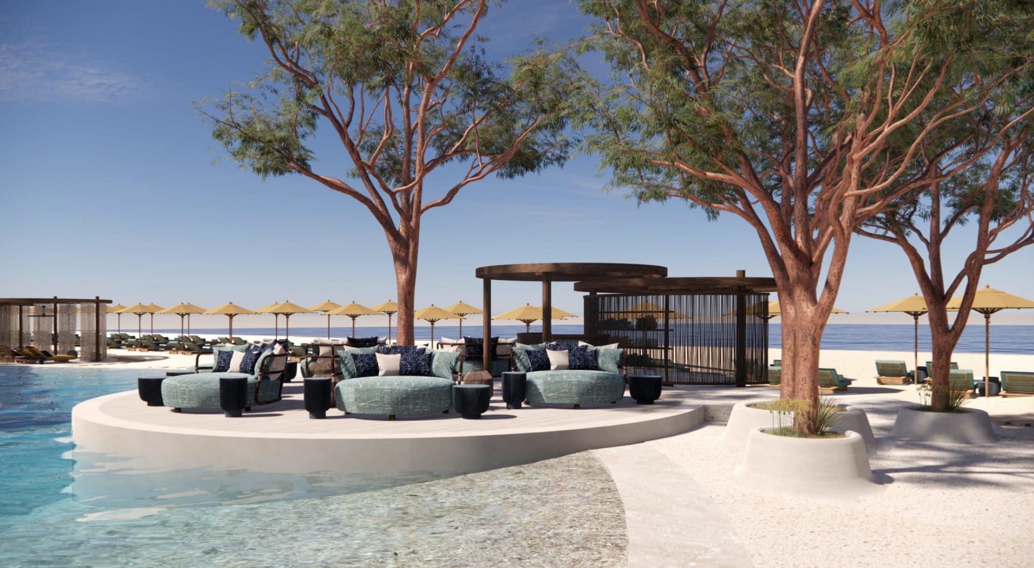 Elegant hotel pool area with turquoise lounge seating and beach view