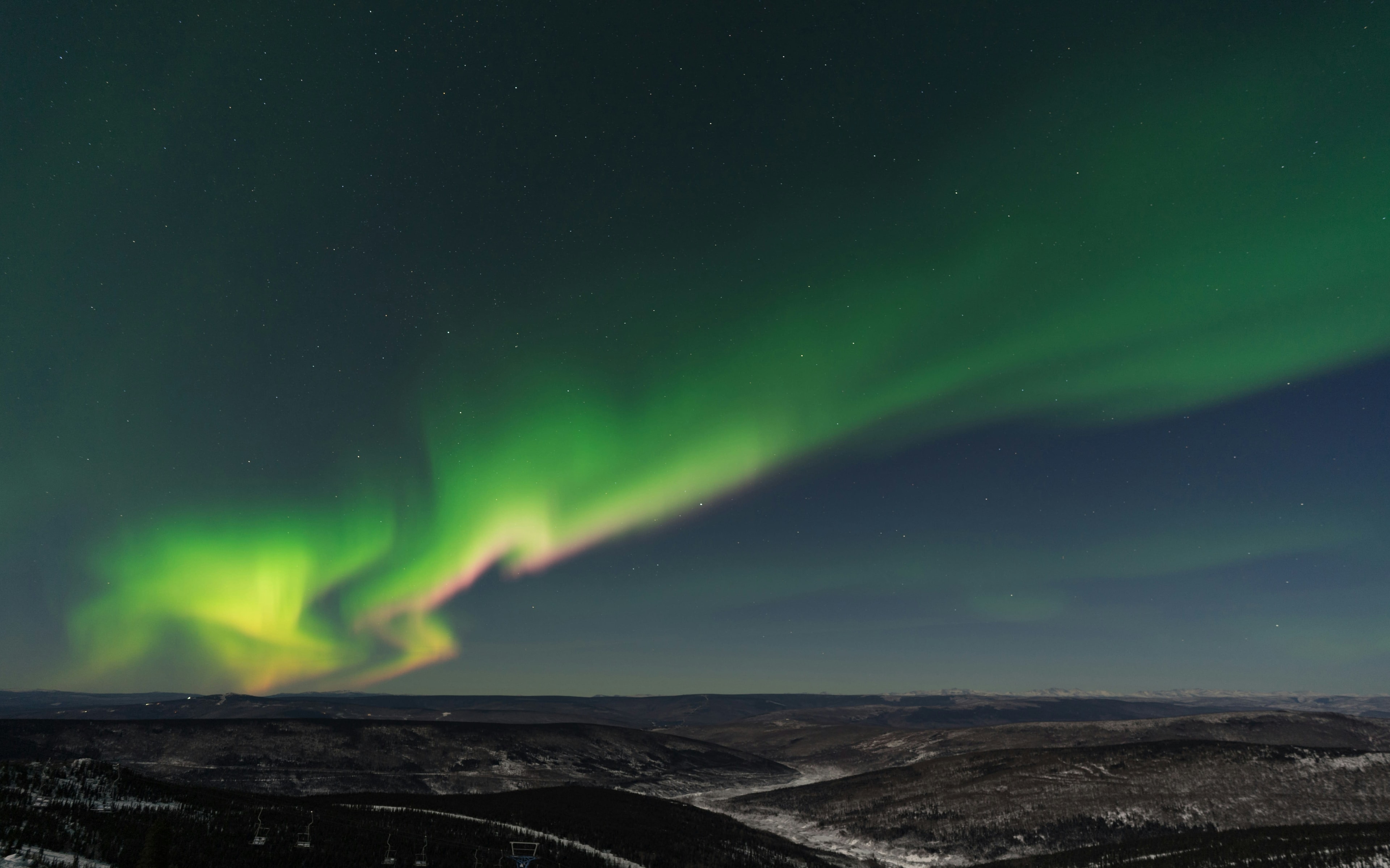 The northern lights shining above Fairbanks, Alaska at nighttime
