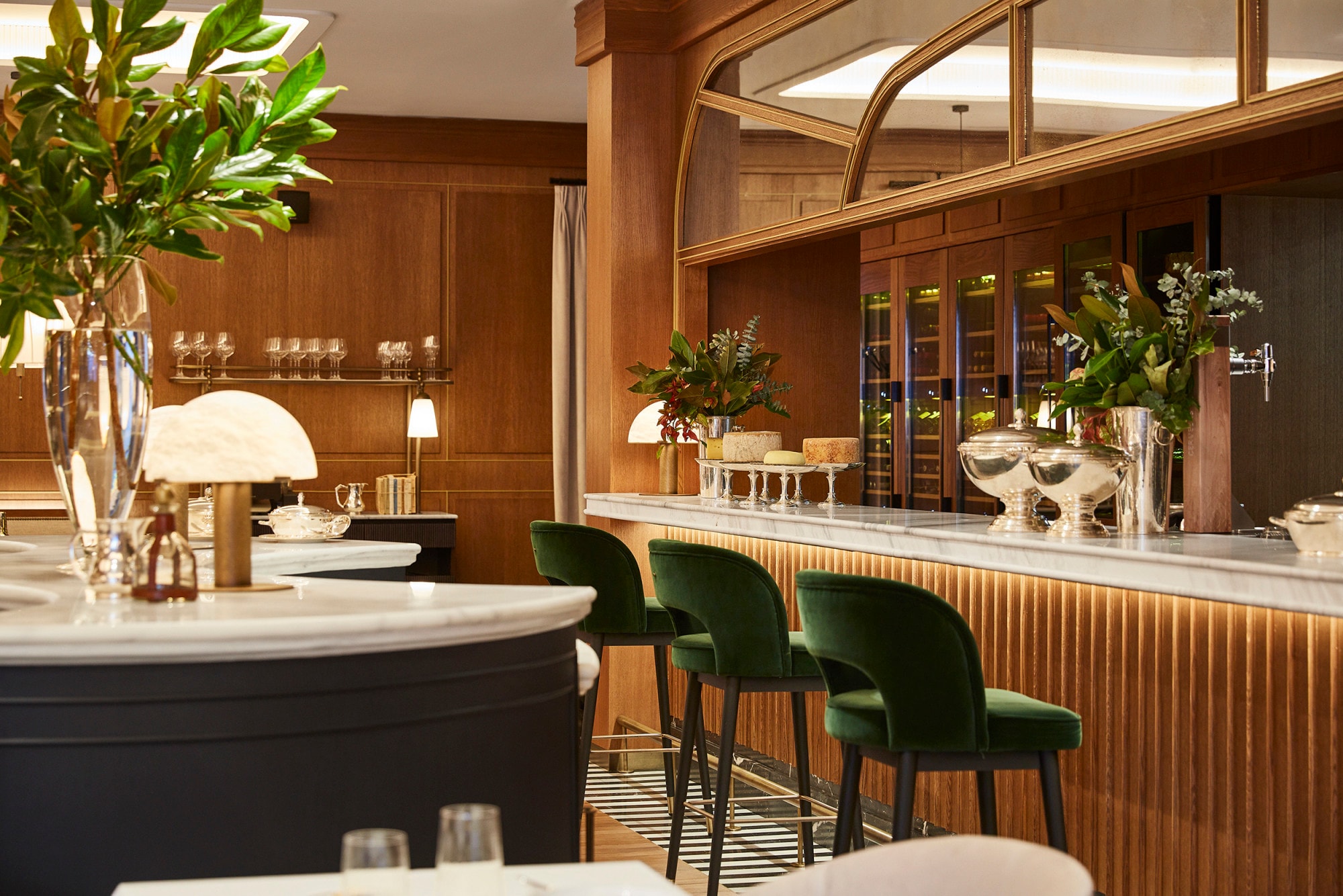 red velvet bar stools line a handsome bar