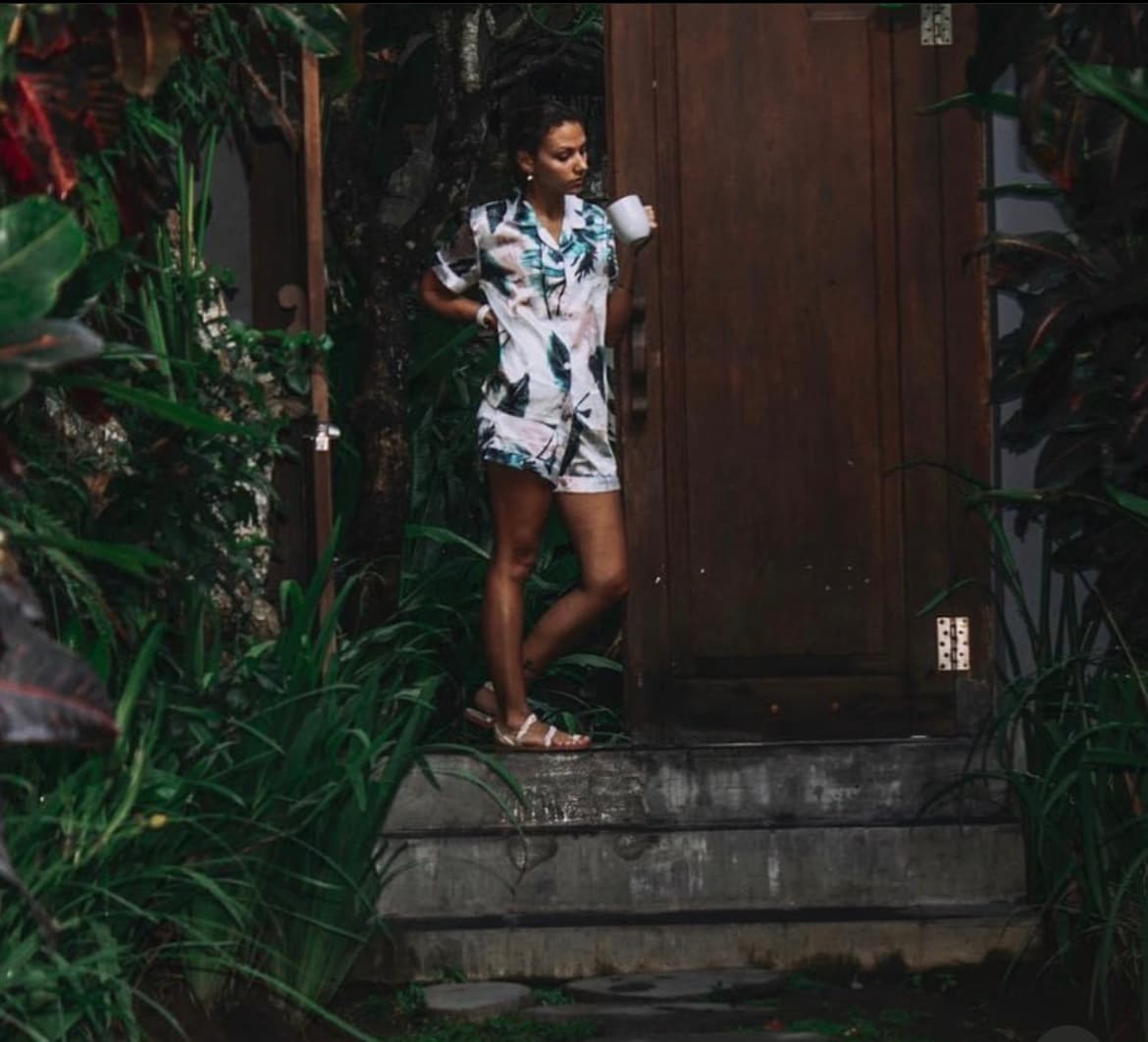 Travel advisor posing beside a door