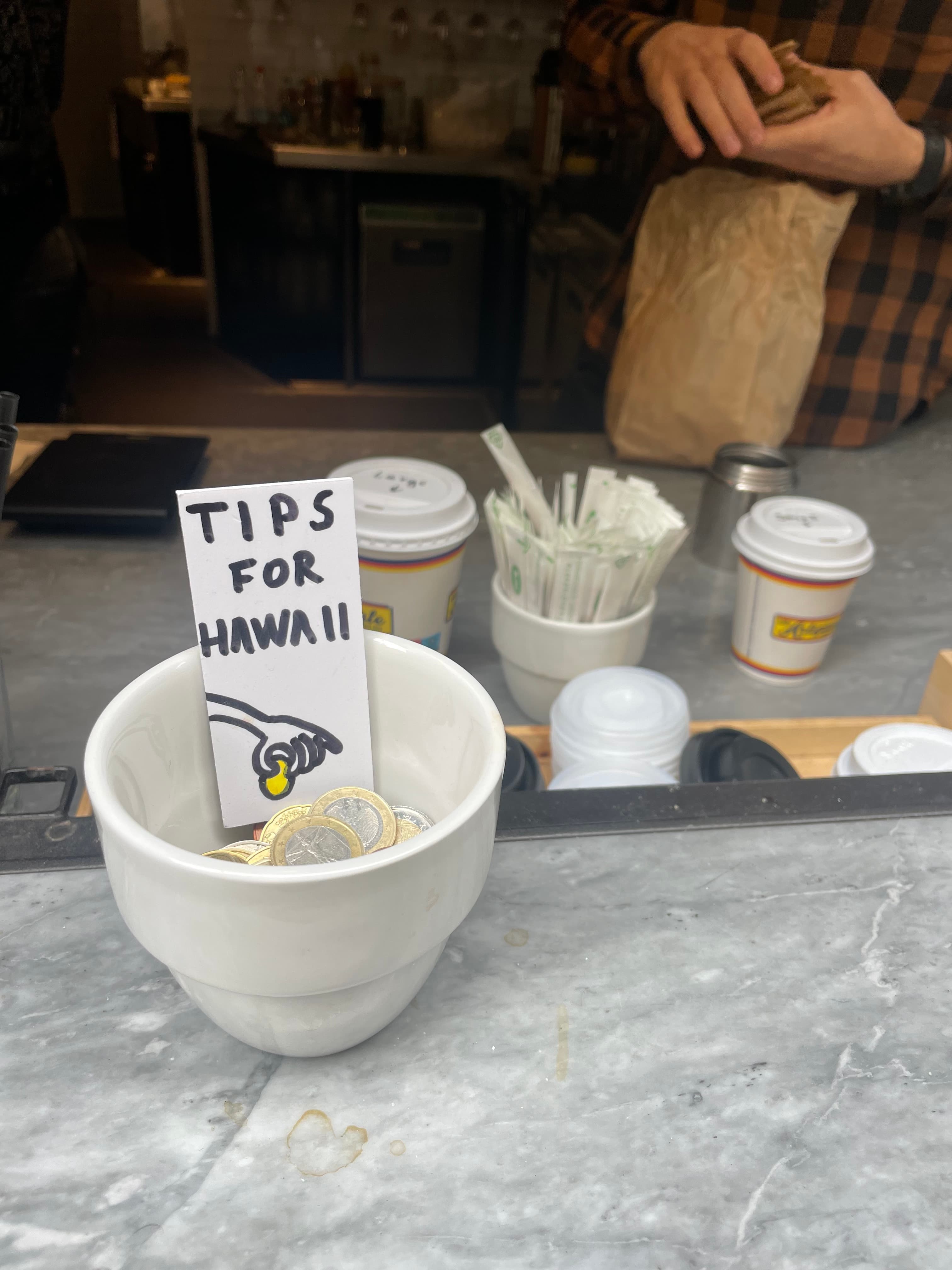 A bowl for collecting tips for Hawaii