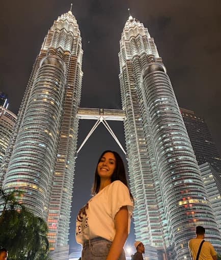 Girl next to skyscrapers in Dubai.
