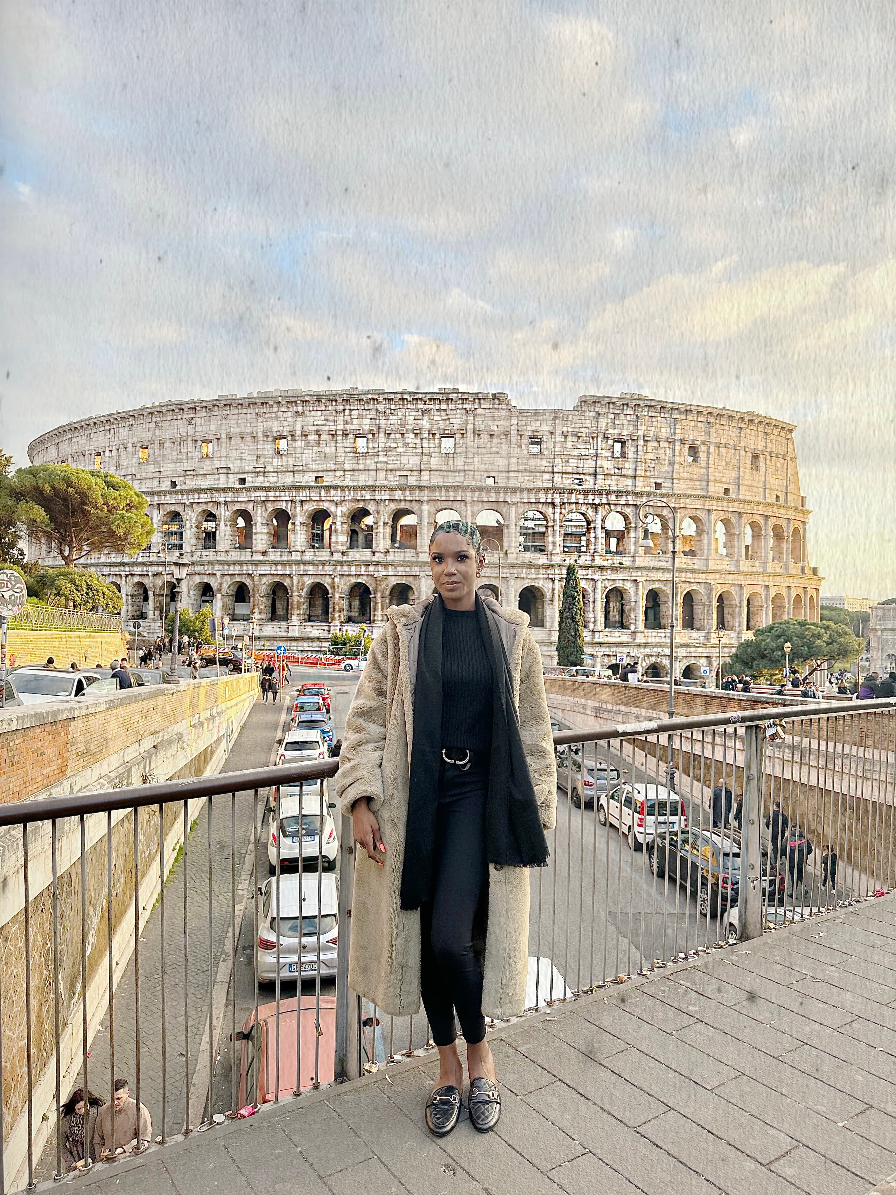 Travel advisor posing on the top of a building