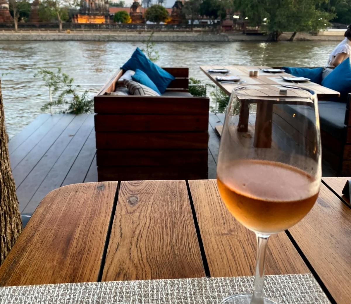 A wine glass with a view at sunset 