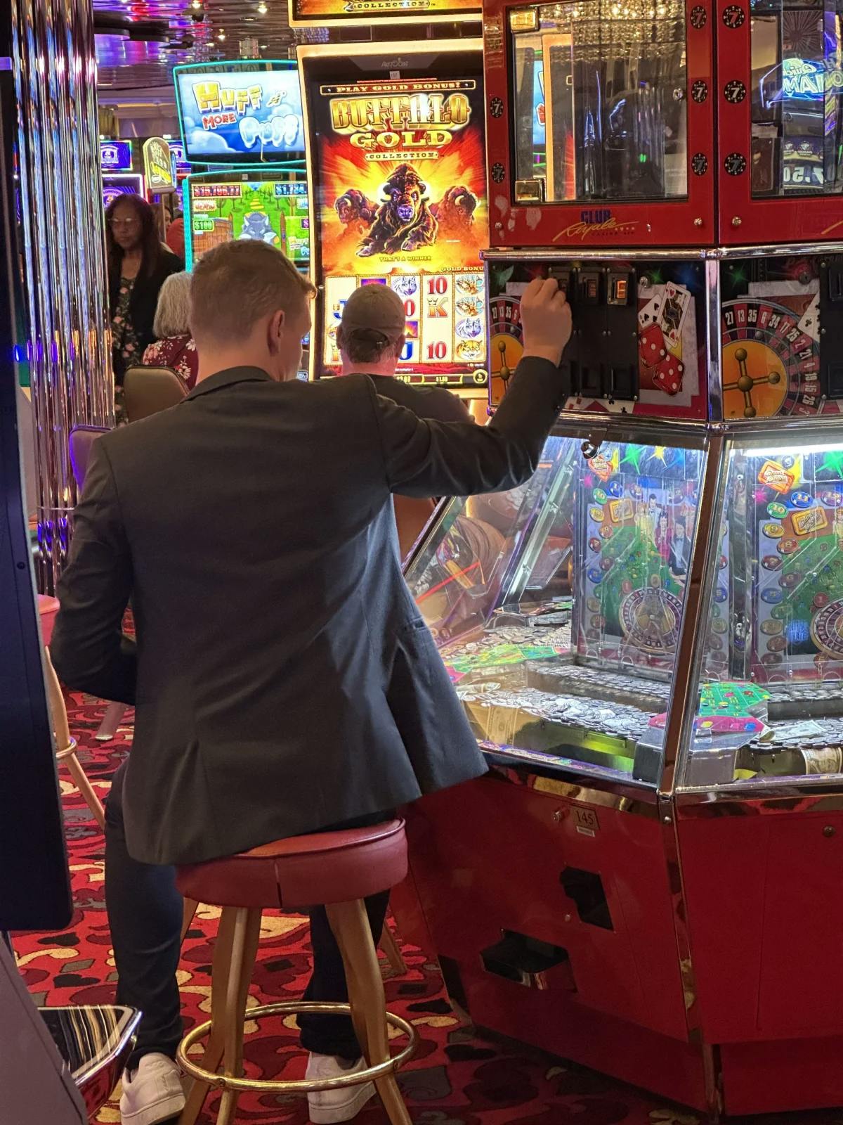 A person playing a machine in a casino 