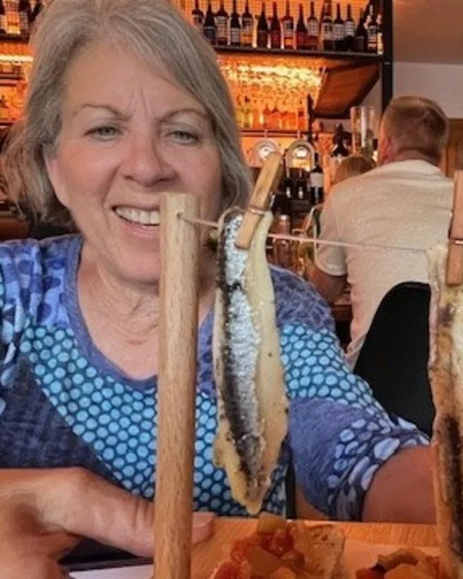 Picture of Rita eating Sardine Tavira Portugal