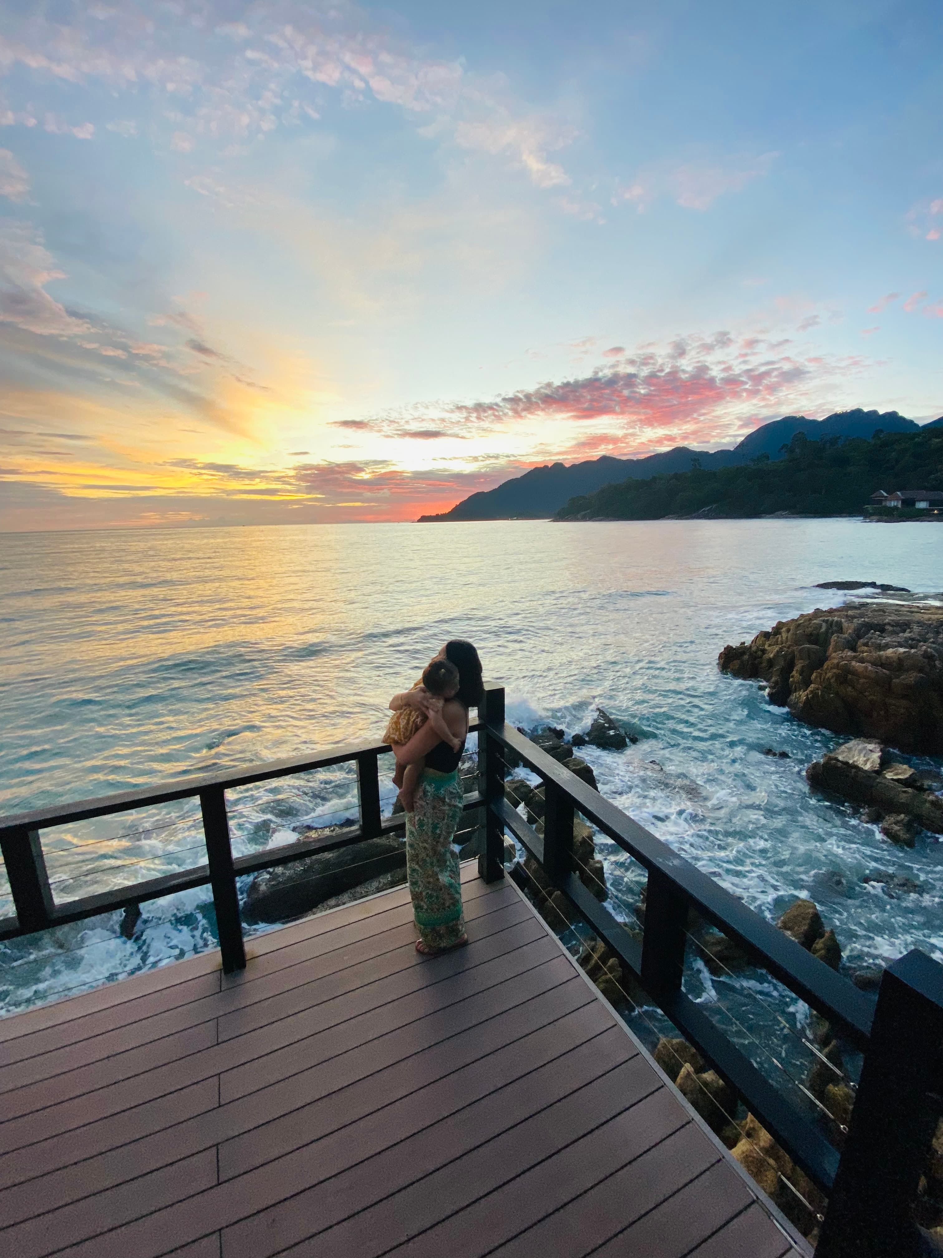 Picture of Celine with baby at sunset
