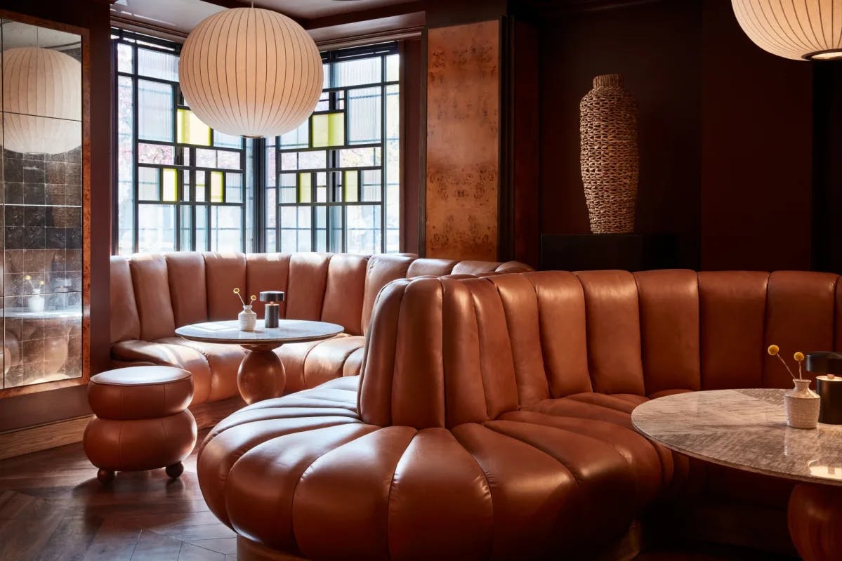handsome upholstered booths in a cozy bar corner