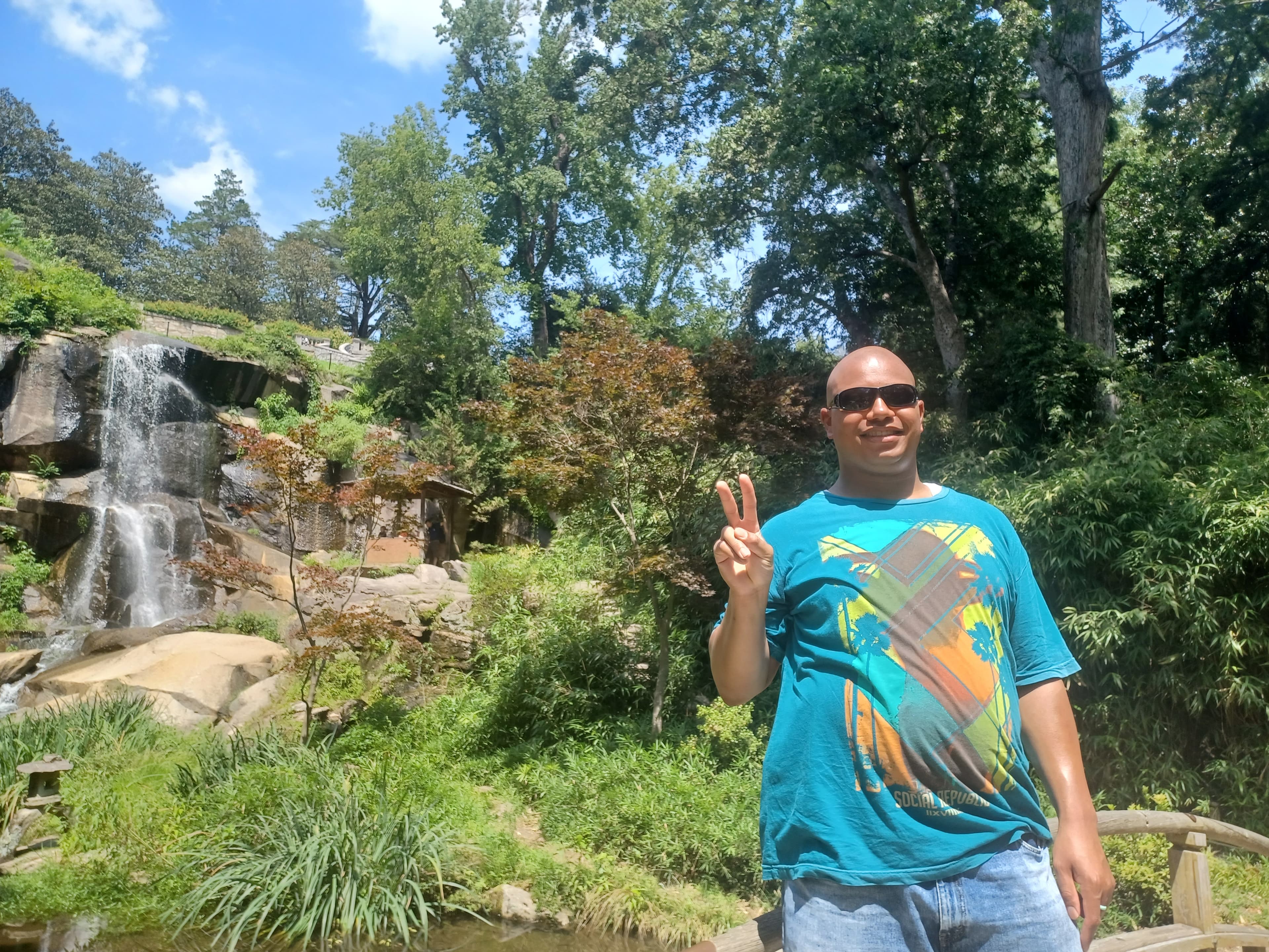 Posing by the waterfall