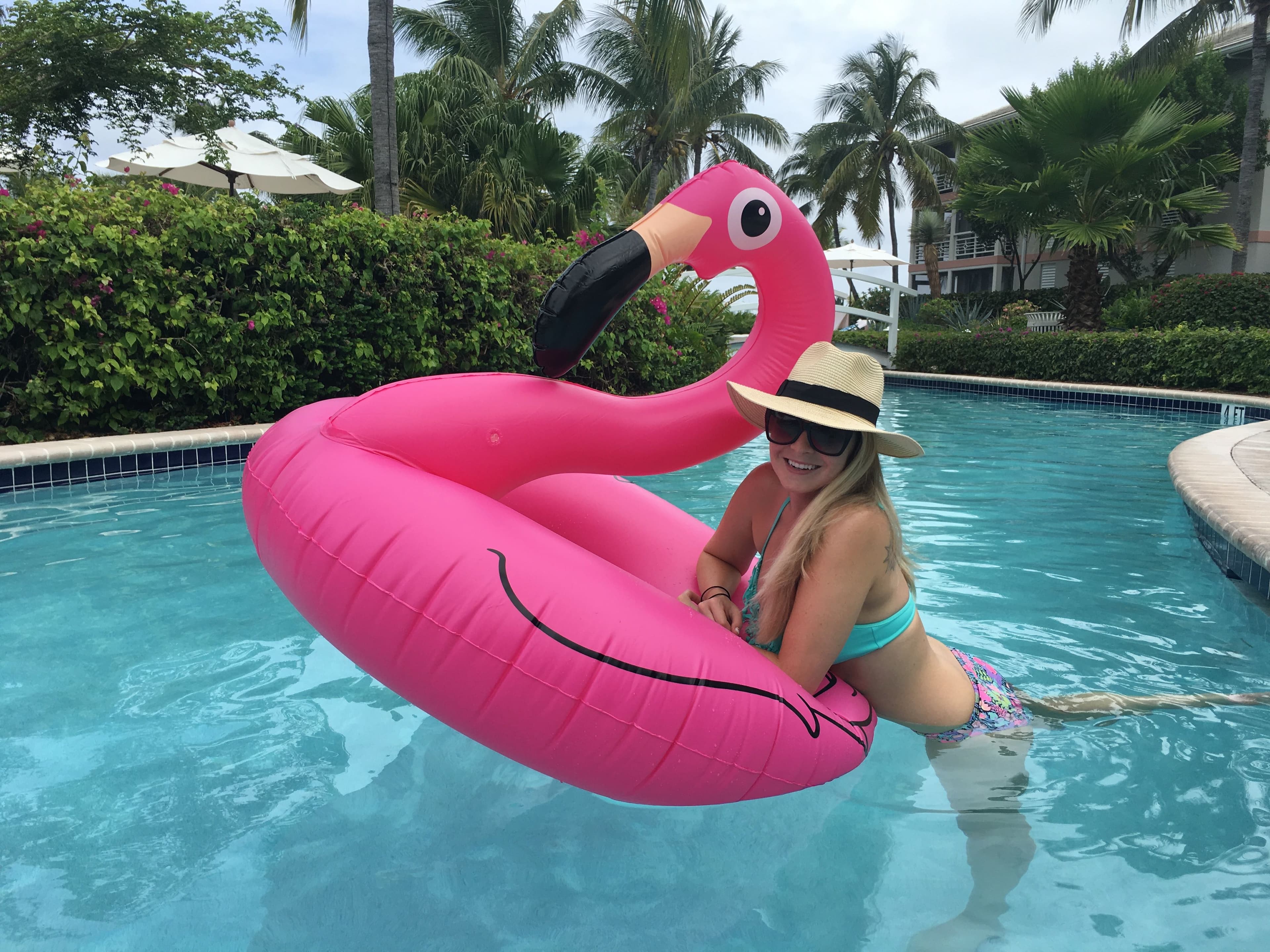 In the pool with a pink flamingo tube