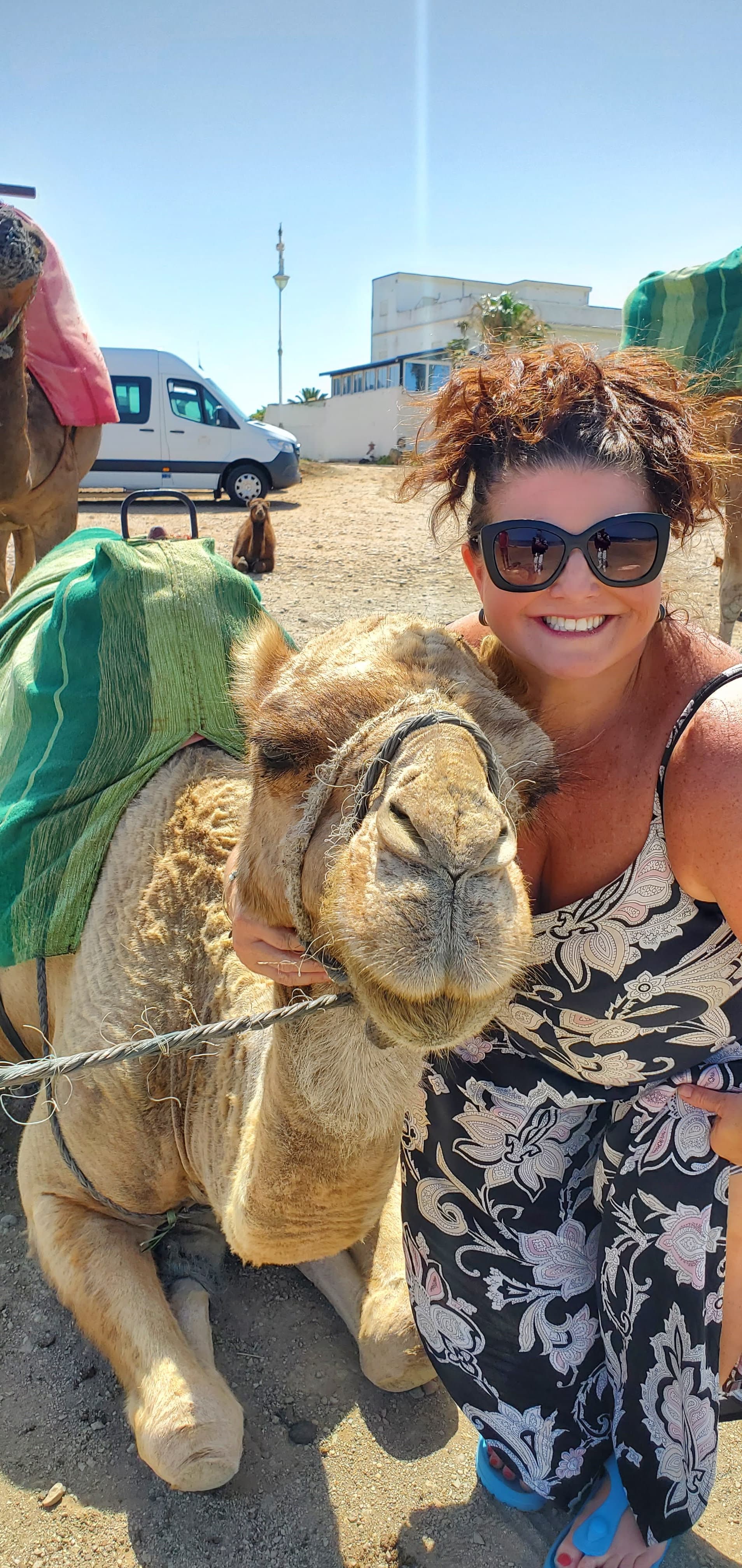 Travel advisor posing with a camel