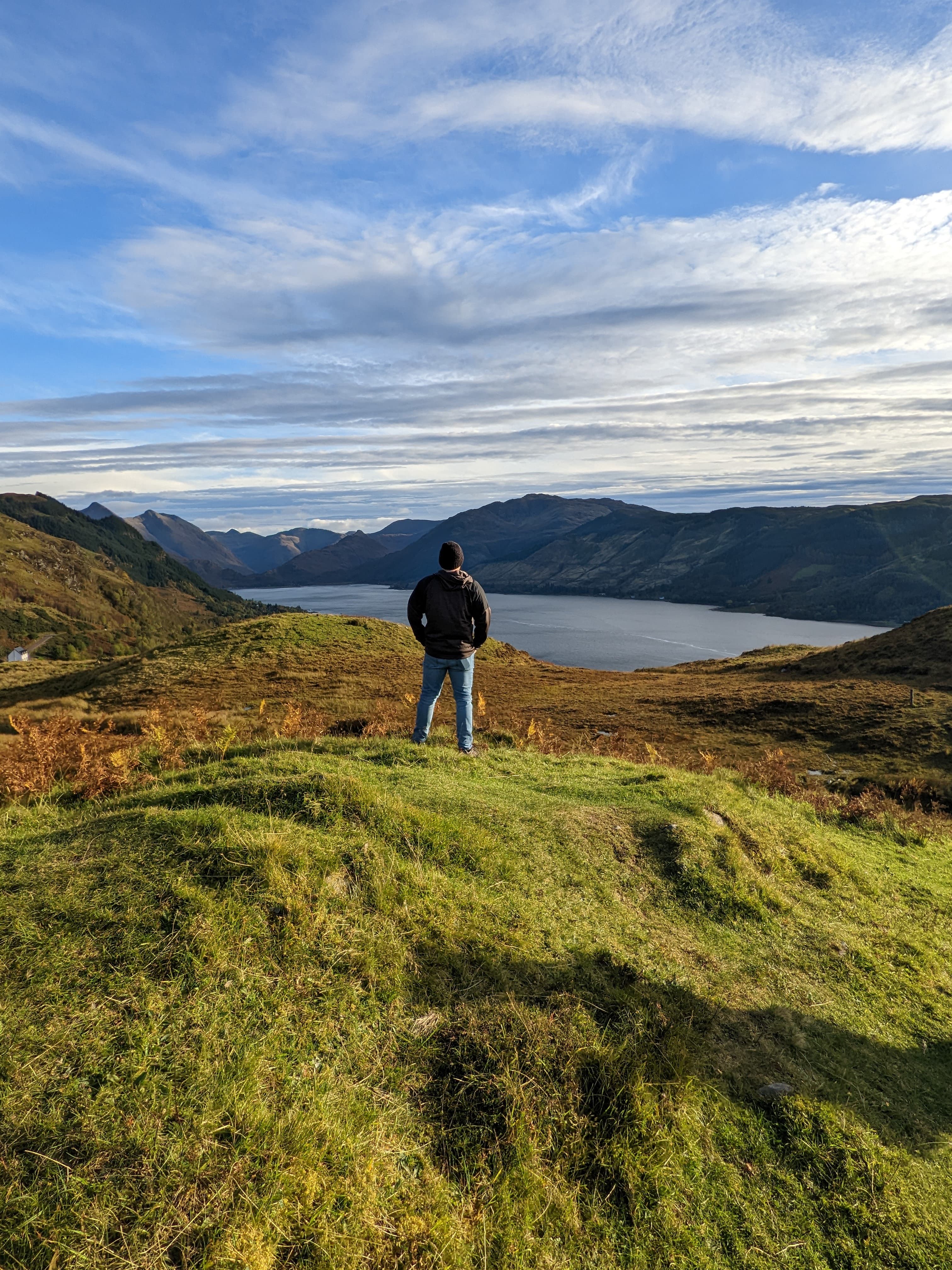 Travel advisor posing in a valley