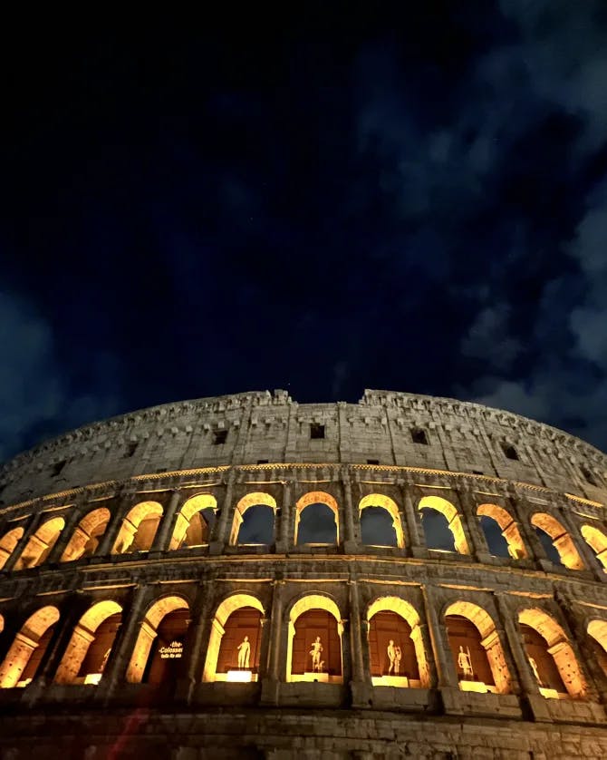 A beautiful view of the Roman Colosseum at night