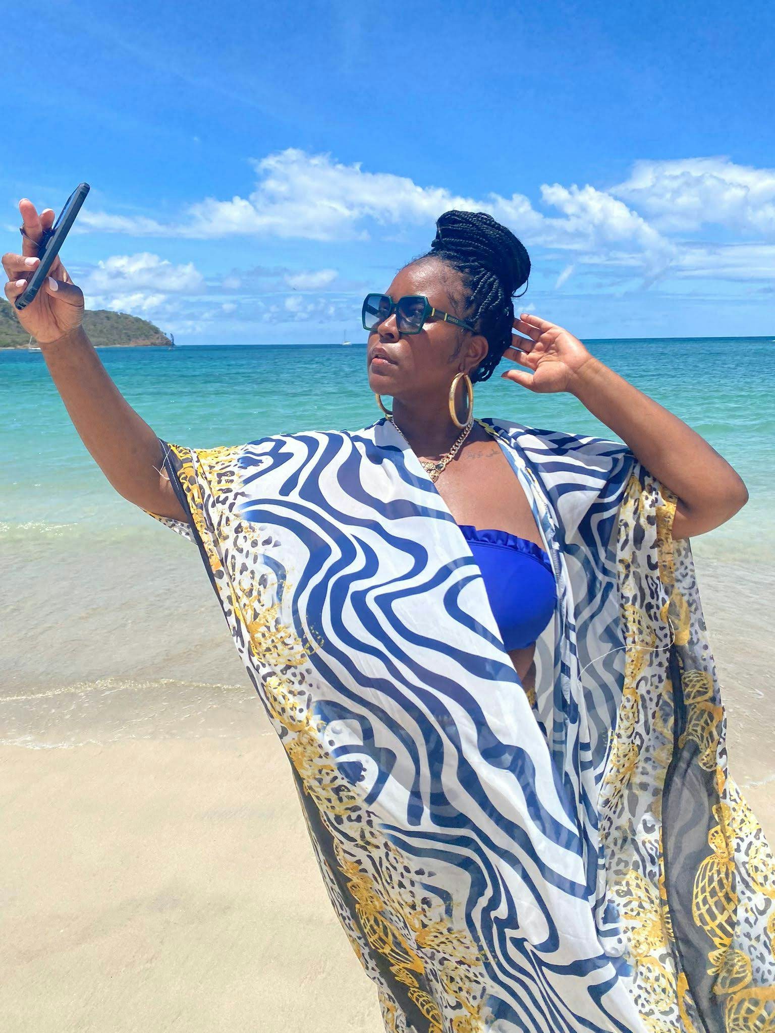 Travel advisor Diamond Durant posing for a selfie on a beach