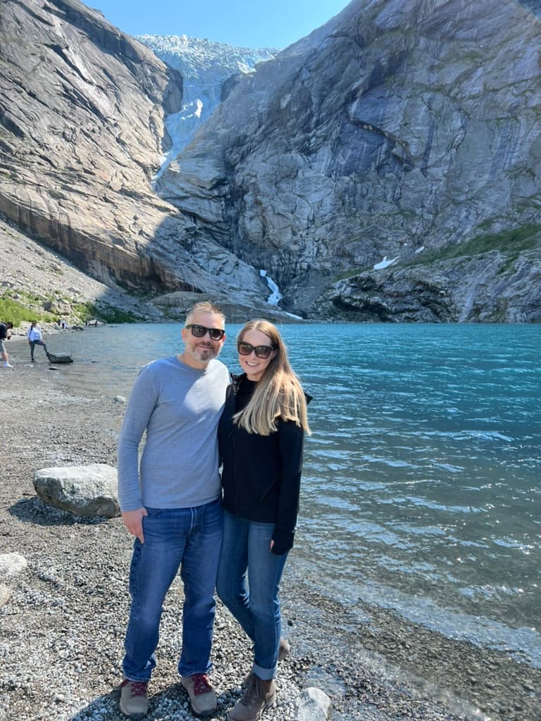 Posing for a photo by the lake