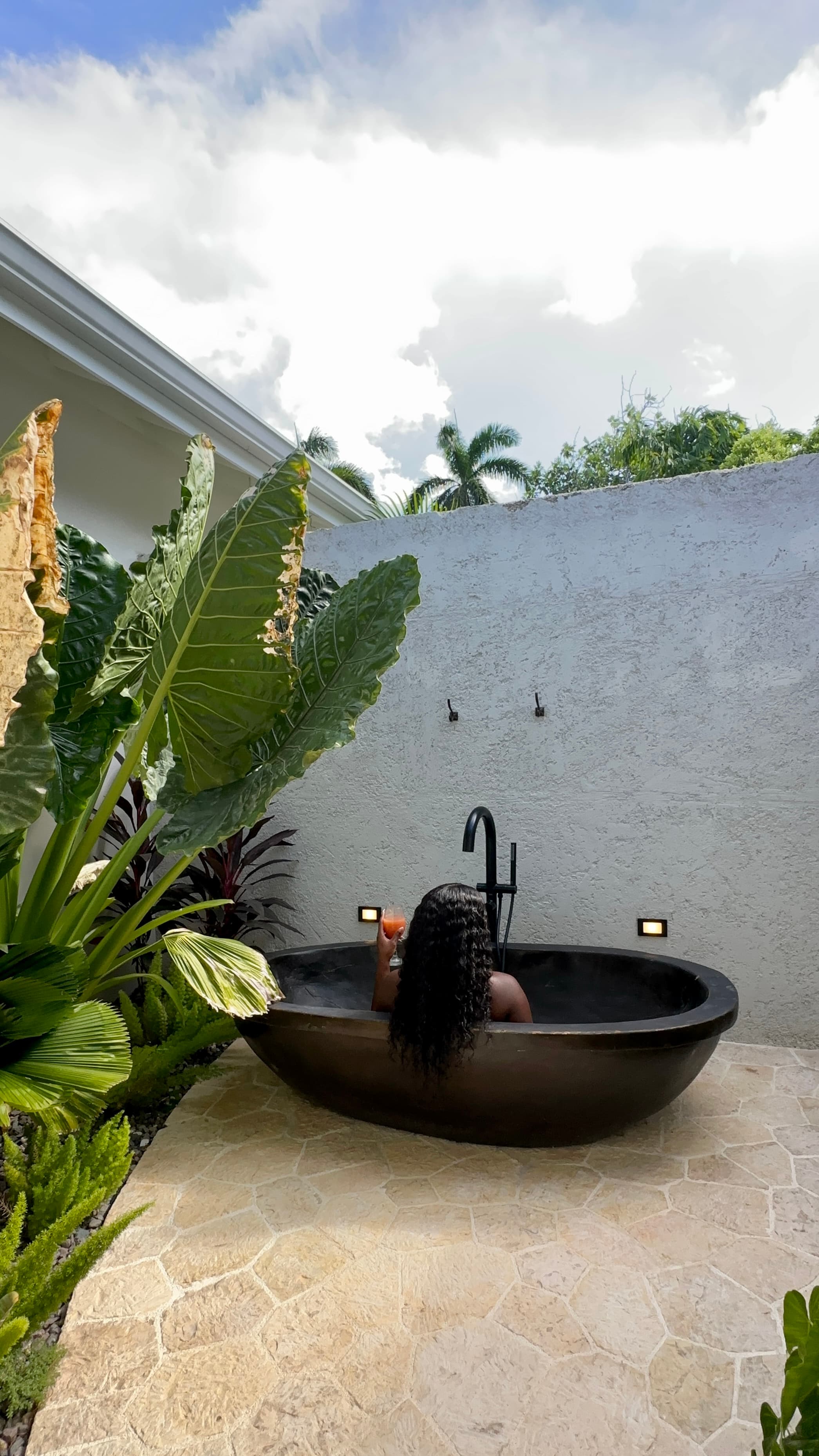 Travel advisor posing in a bath tub
