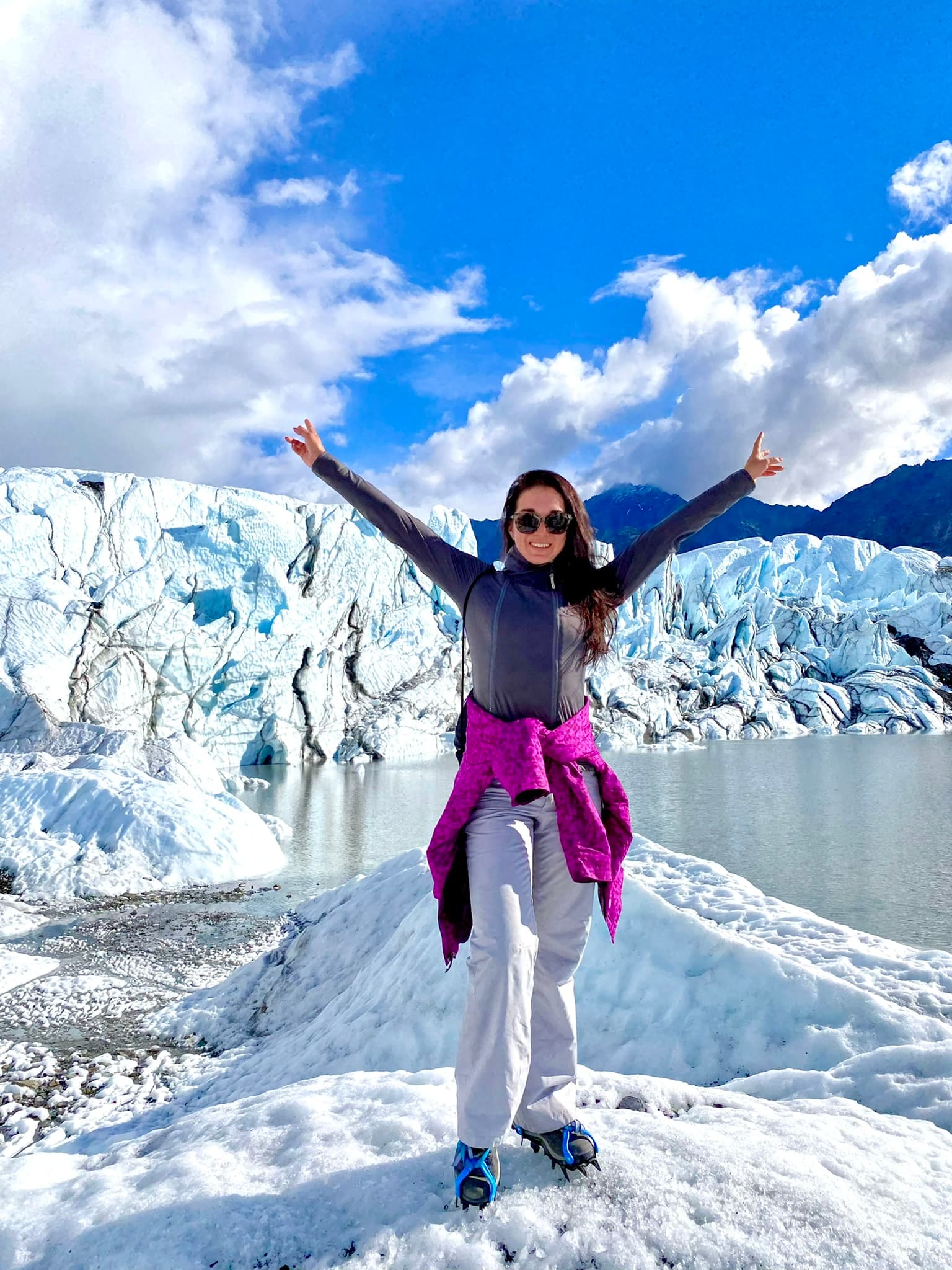 Travel Advisor posing in a snow covered mountain range.